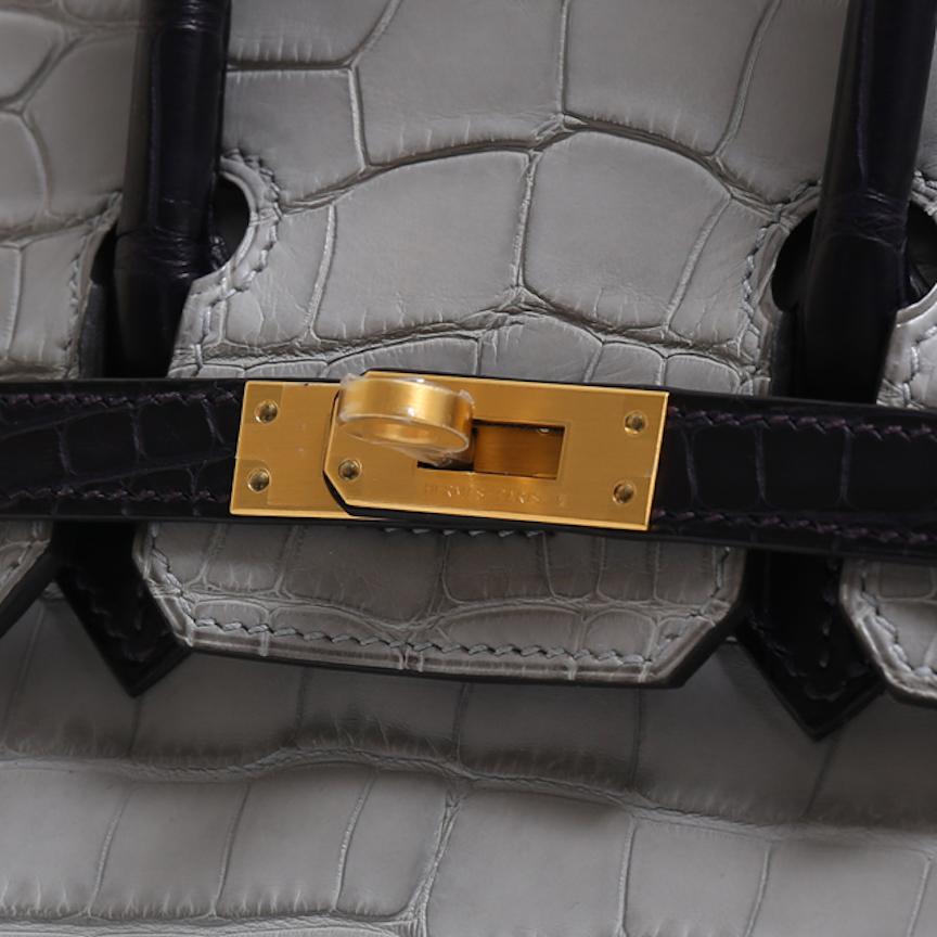 It Gets No Better Than This.

This special order Hermes Birkin 25 bag is the ultimate status symbol for only the most discerning of Hermes collectors. Crafted of exotic crocodile and alligator skins and palladium tone hardware, this gray and purple