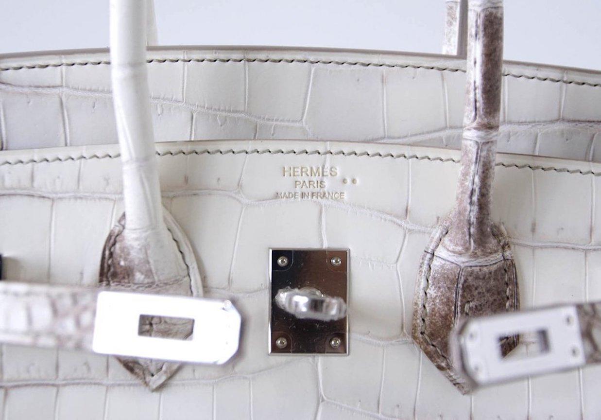 The Crème de la Crème of Hermès.

The most prized Hermes Birkin in the world, this beautiful white Hermes Birkin 25 Himalayan boasts spectacular Crocodile Niloticus skin. Brand new with all original accompaniments, this rare beauty is unlike any