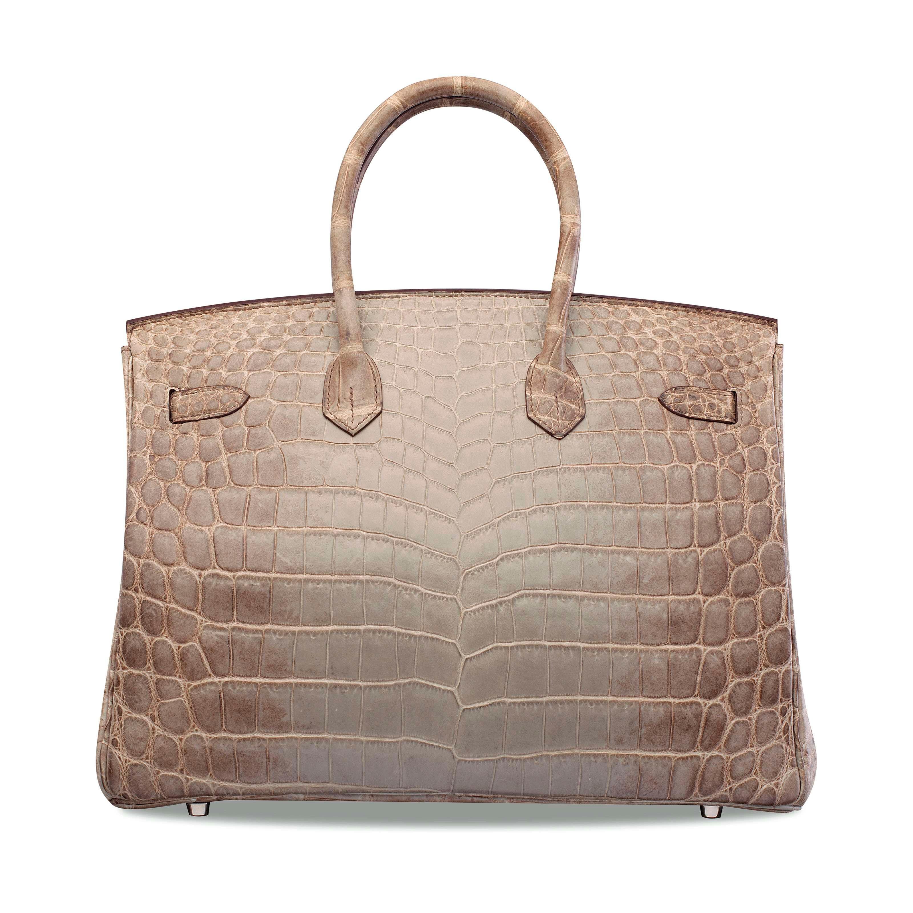 The Crème de la Crème of Hermès.

The most prized Hermes Birkin in the world, this beautiful Gris Cendre Hermes Birkin 30 Himalayan boasts spectacular Crocodile Niloticus skin.  Brand new including all original accessories, this rare beauty is