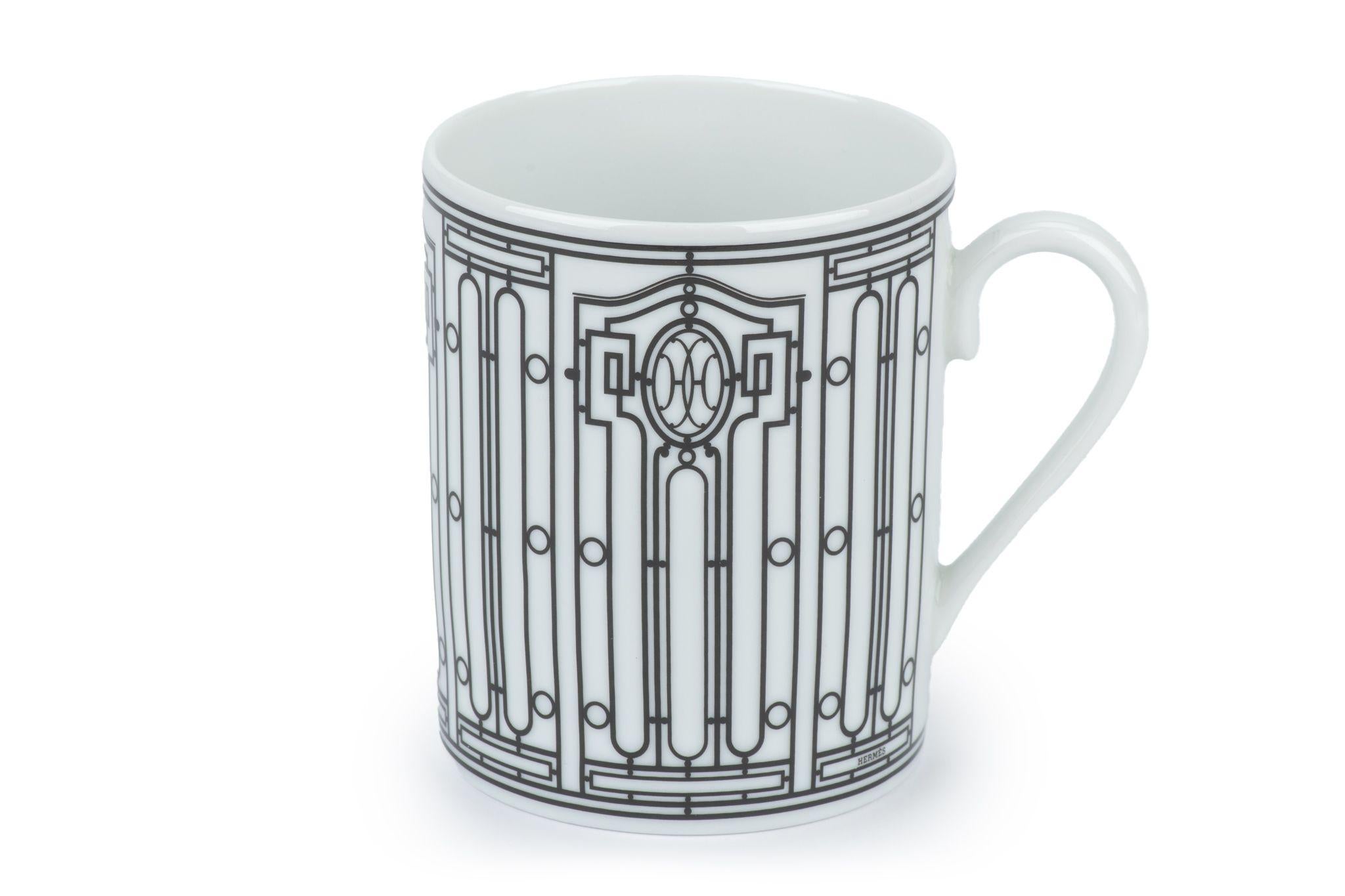 The Hermès H Art Deco Mug, features the Hermès 24 Faubourg and rue de Sèvres stores, inspired H Déco collection including the mug. The service is stamped with the initials HH, around which an intricate black and white decoration spirals.
New, comes