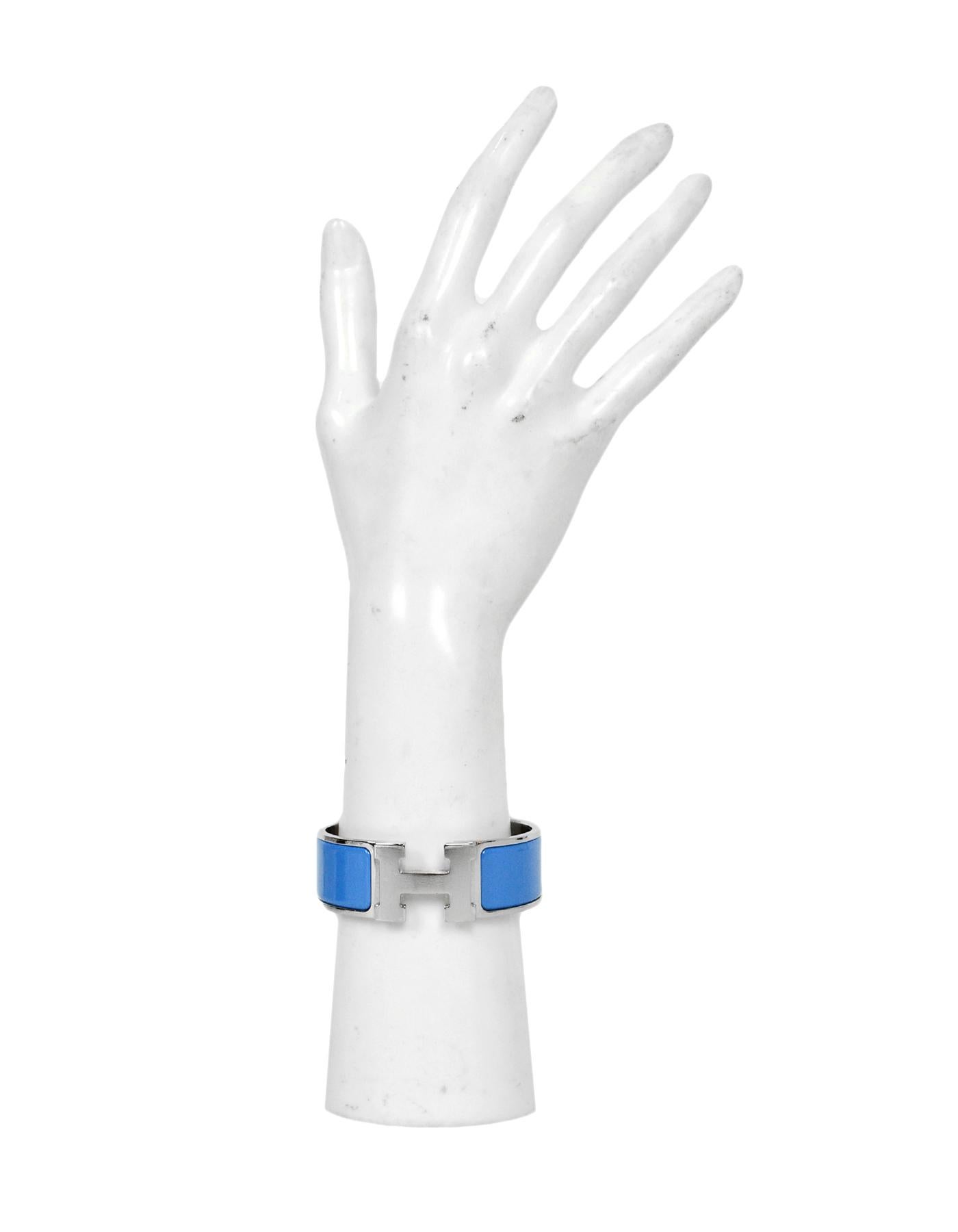 Hermes New Bleu Cielo /Palladium Wide Enamel H Clic Clac Bracelet
Color: Blue and silvertone
Materials: Enamel, palladium plated metal
Closure/Opening: Swivel H
Overall Condition: Like new pre-owned condition.  Protective plastic still on H.  Please