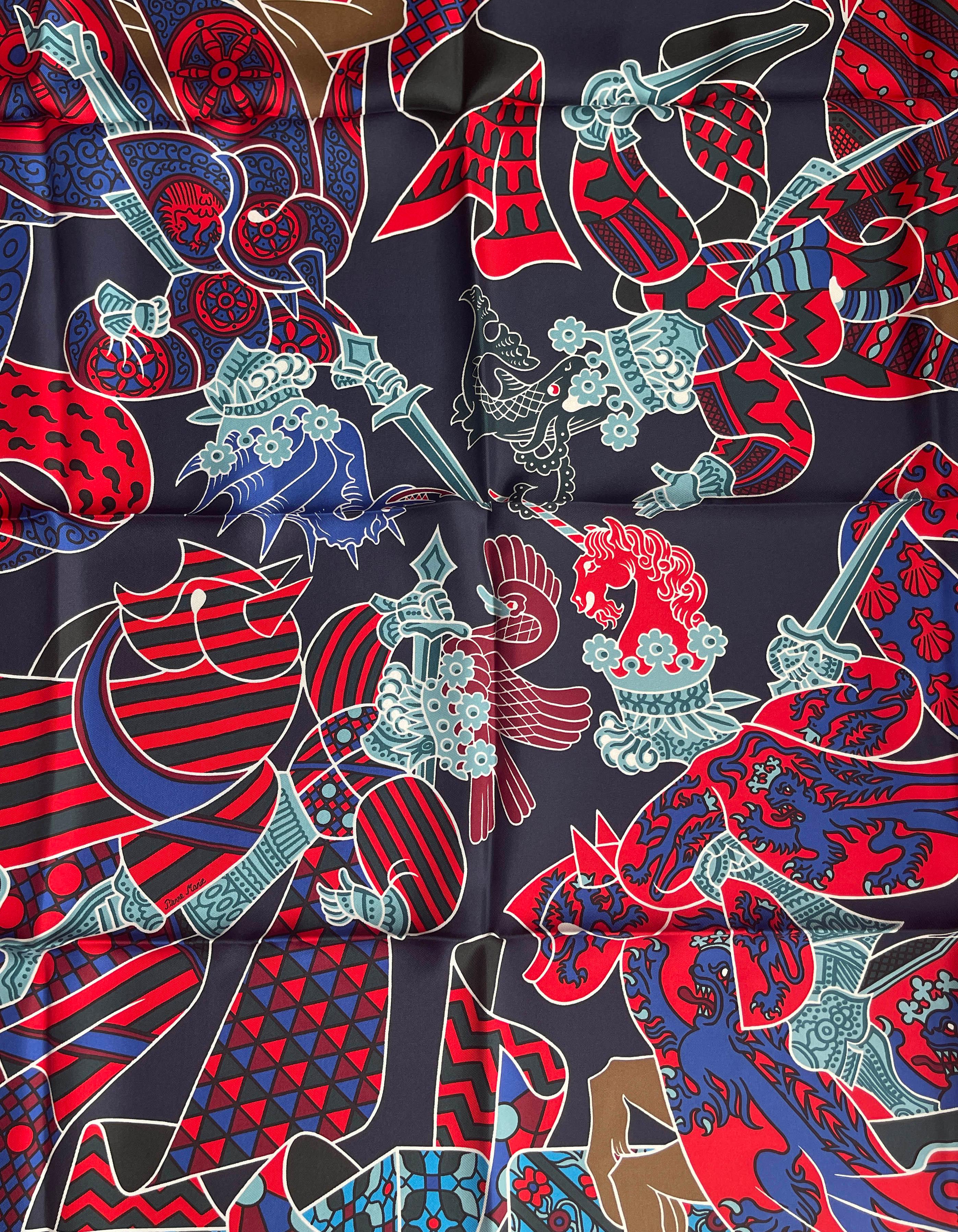 Hermes Blue Marine/Rouge Duels Oniriques 90cm Silk Scarf Designed by Pierre Marie

Made In: France
Color: Blue, red, multicolor
Materials: 100% Silk
Overall Condition: New condition with original tag attached. This item was purchased at a Hermes