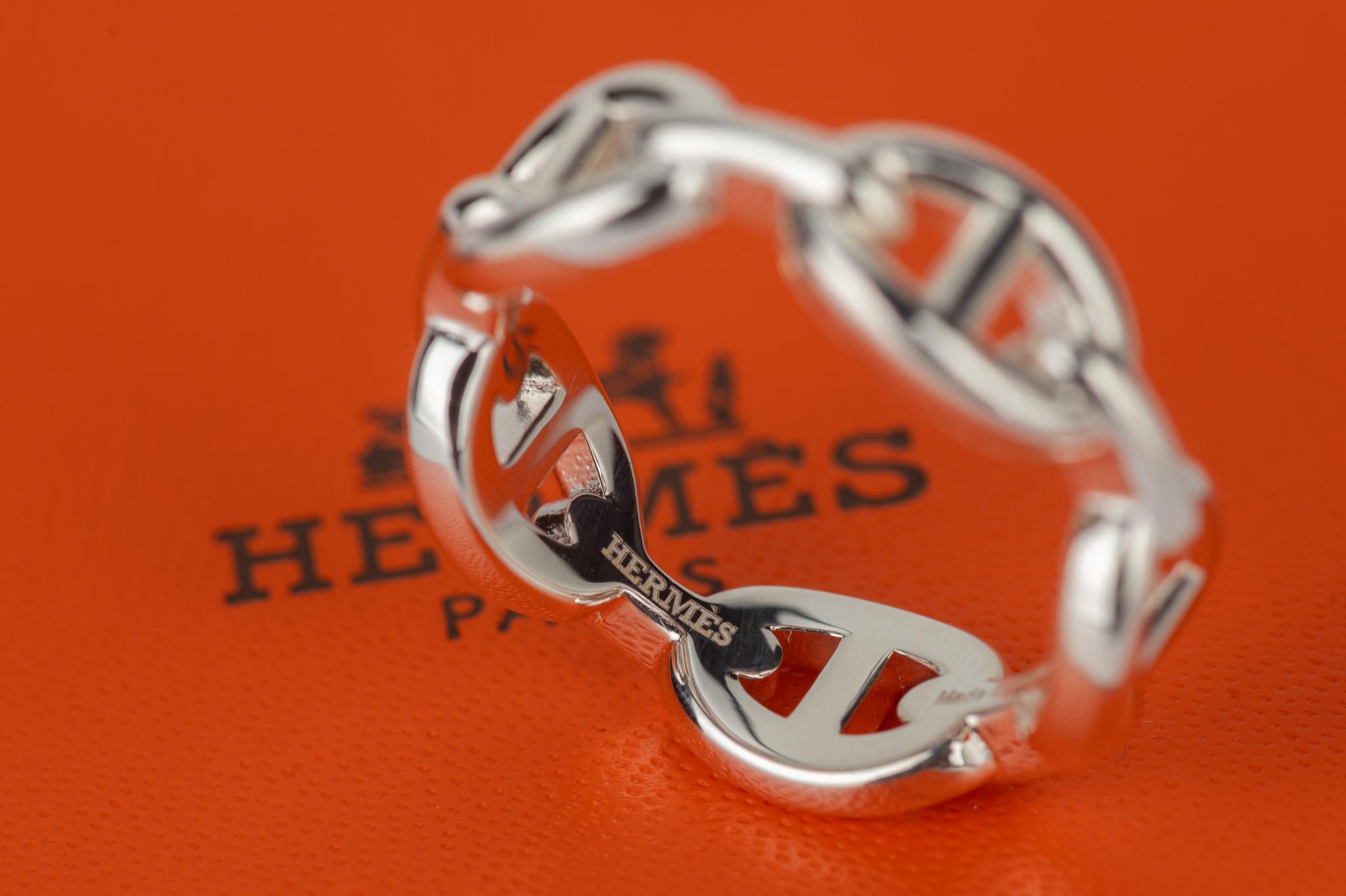 The Hermès Chaine D'Ancre Scarf Ring in sterling silver, new in unworn condition.  Comes with ribbon and original box. Size 8.