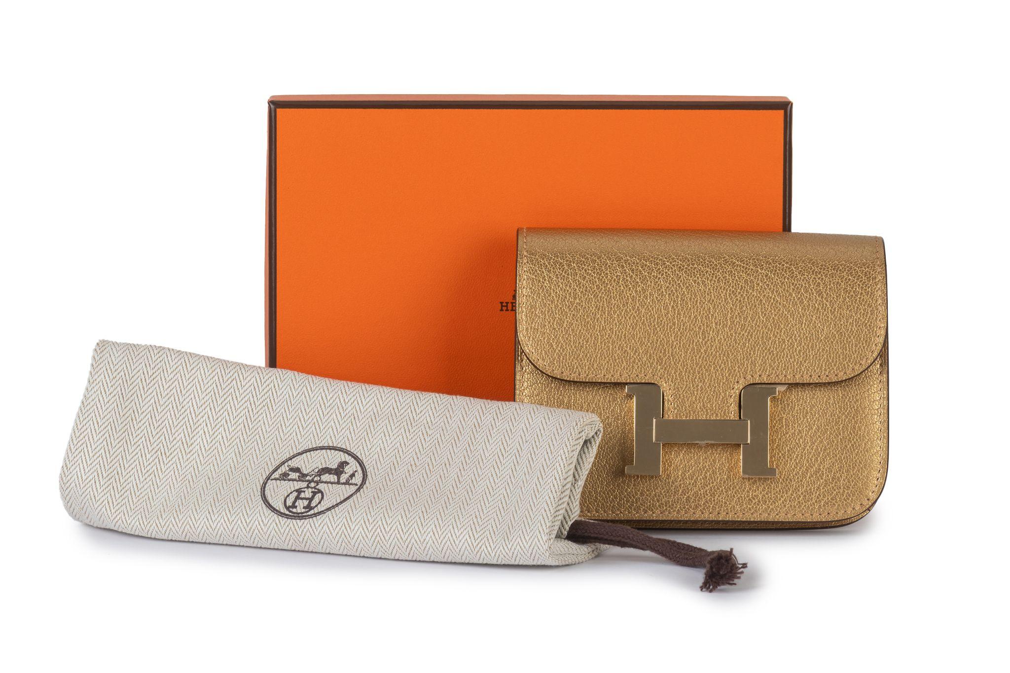 Portafoglio Hermès New Gold Costance Slim in vendita 7