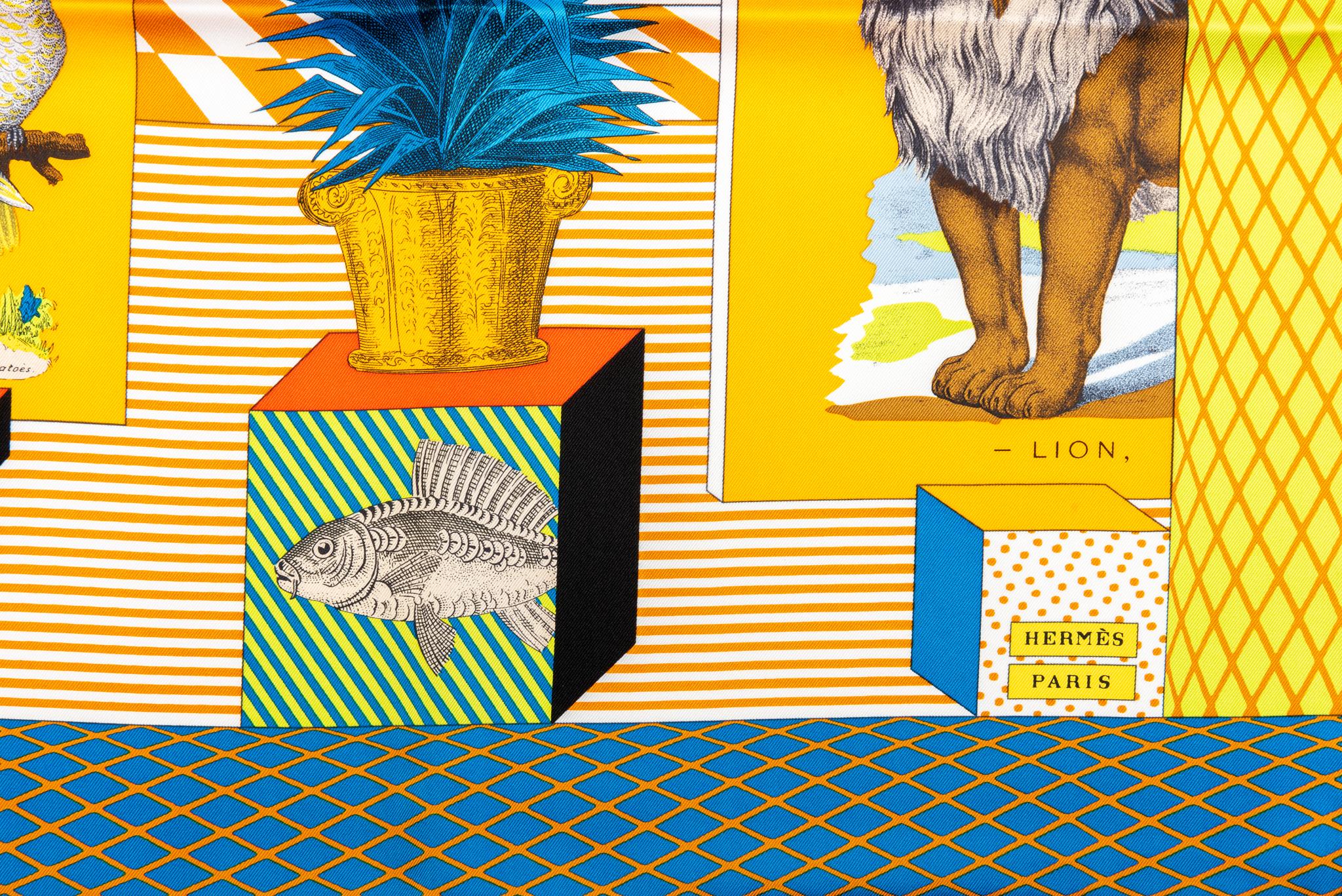 Hermès brand new Grand Theatre Nouveau yellow silk scarf. Hand rolled edges. Comes with original box.