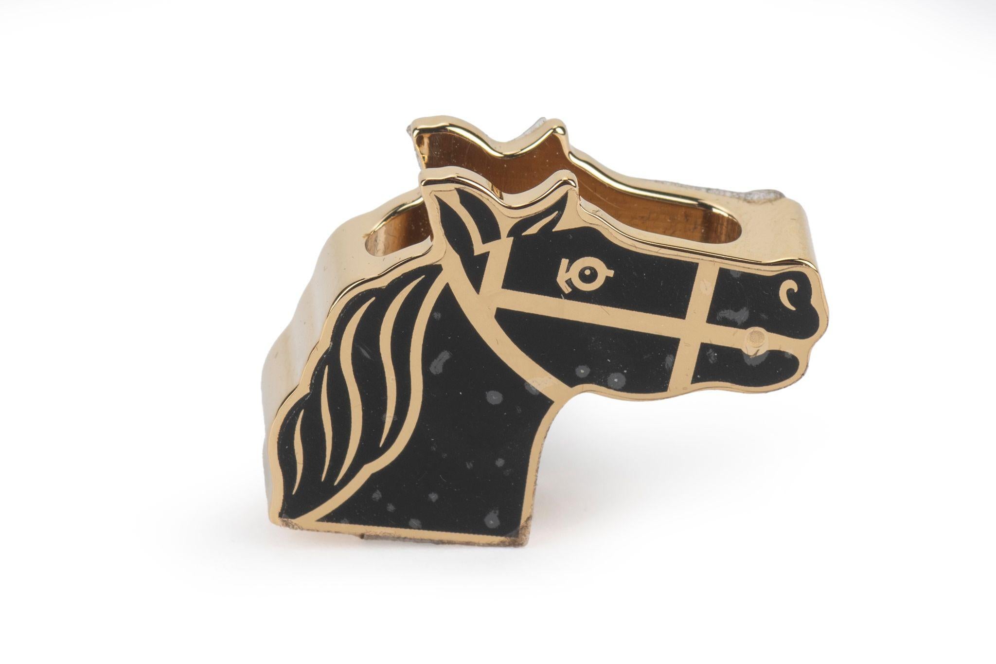 Hermès new twilly ring in lacquered palladium -plated brass.
Black and gold combination. 
Comes with original dustcover and original box. Scarf not included.