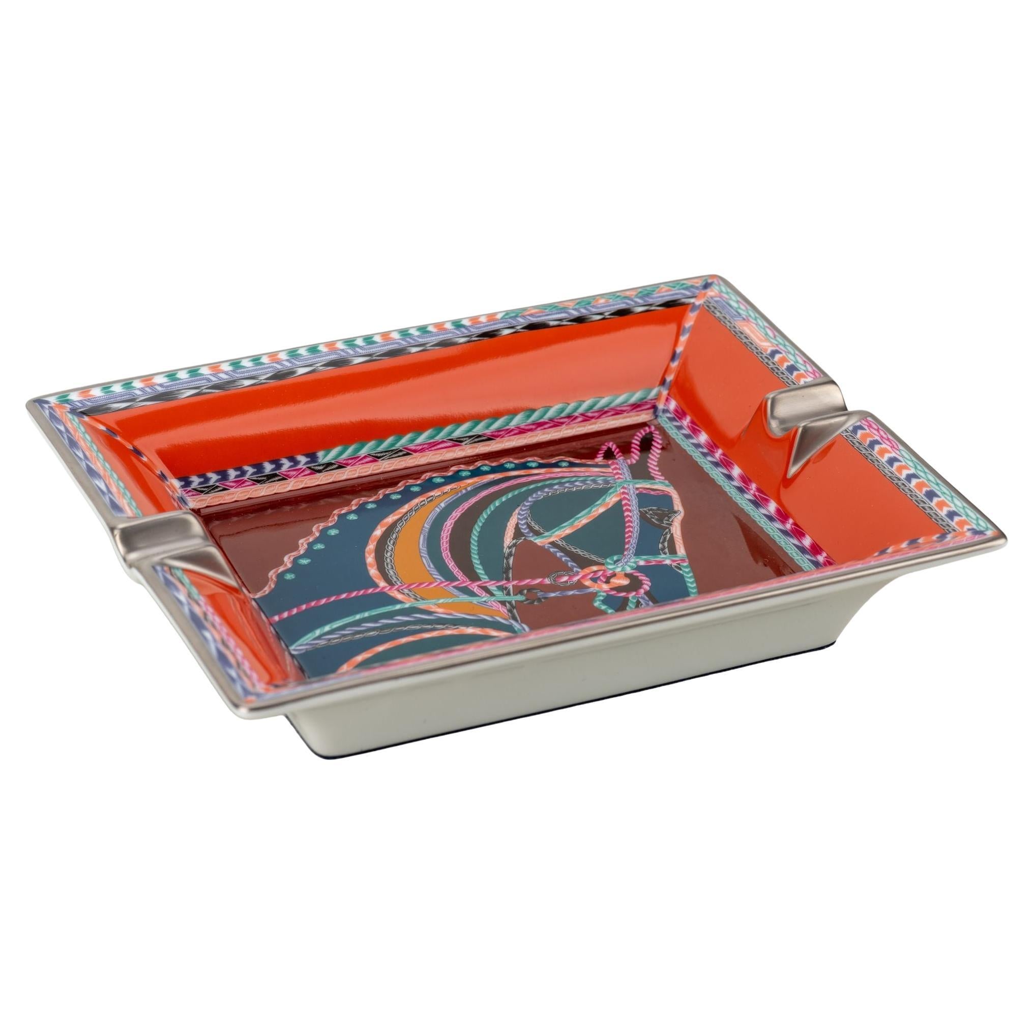 Hermès new red and multicolor porcelain ashtray with horse head design.
Comes with original box.