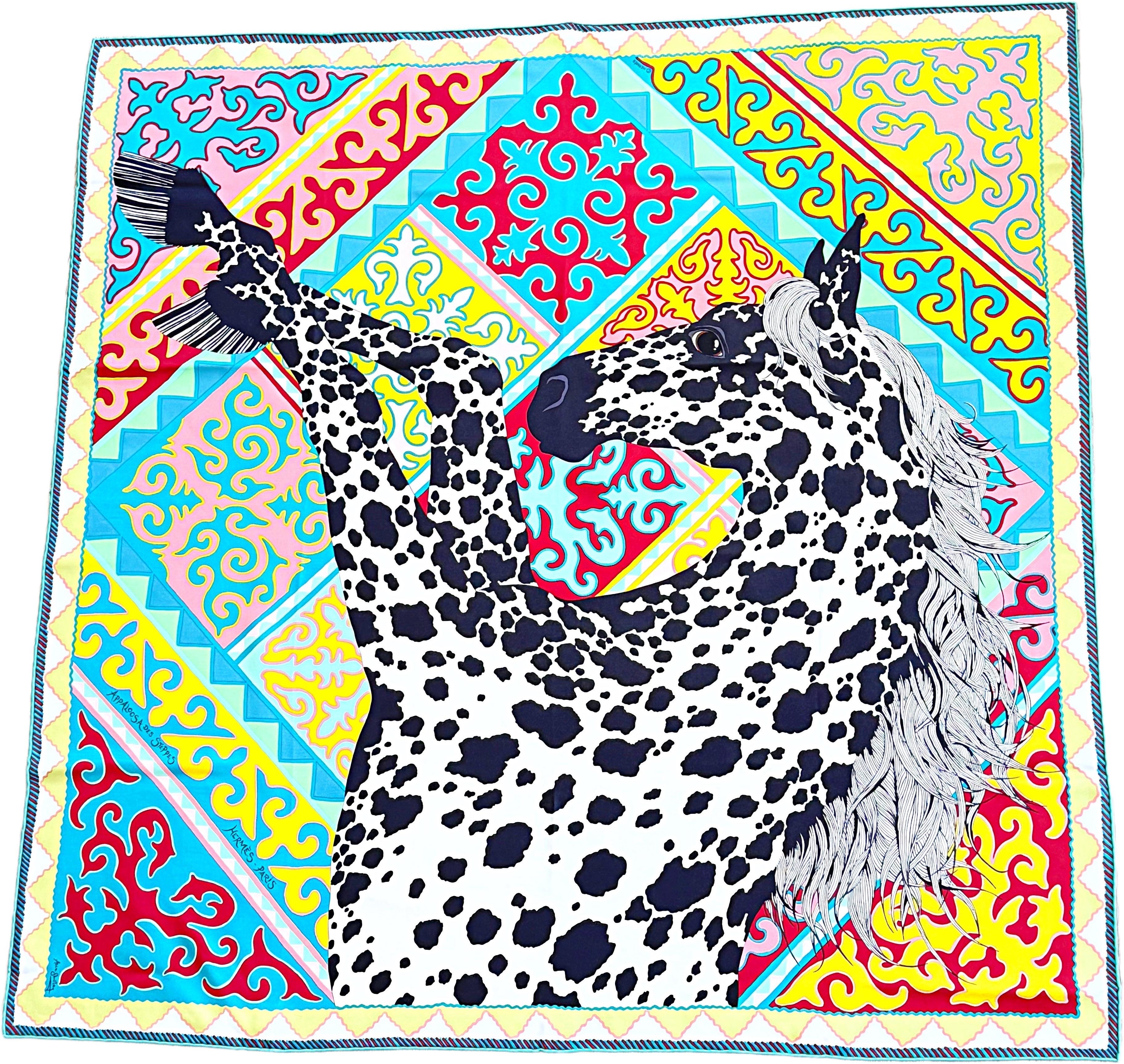 Rare impossible to find in this color way, new with box authentic Hermès silk scarf “Appaloosa des Steppes.” Designed by Alice Shirley in 2017, combines traditional Kyrgyz motifs with the spotted coat of an Appaloosa horse, symbolizing both cultural