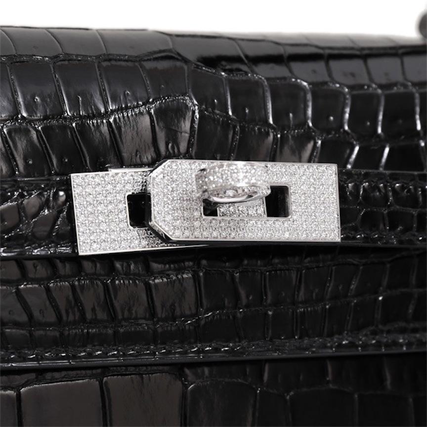 It Gets No Better Than This.

This rare Hermes Crocodile Kelly 25 bag is the ultimate status symbol for only the most serious of Hermes collectors. Crafted of exotic crocodile skin leather, diamonds and 18Kt white gold hardware, this bold, black,