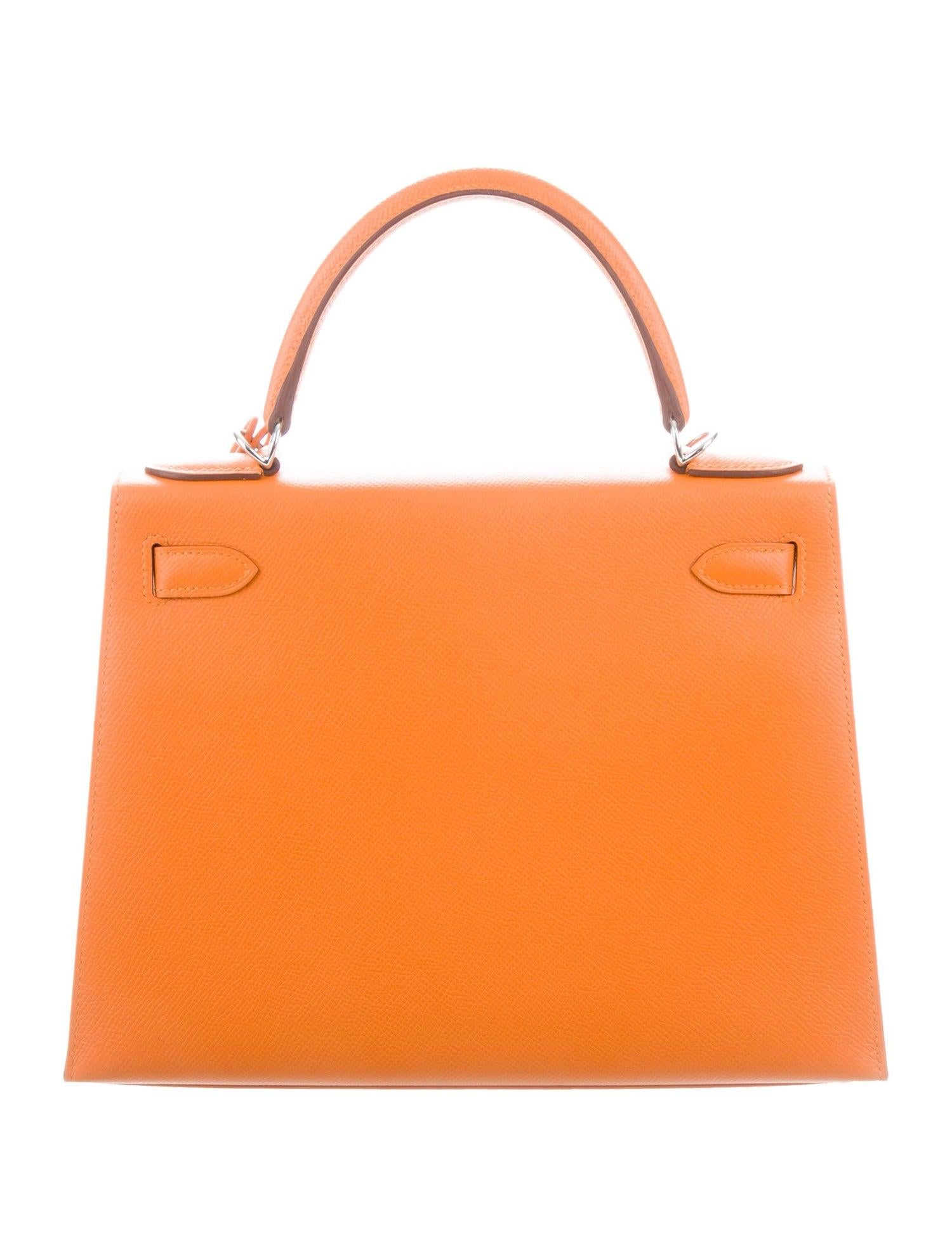 Hermes NEW Kelly 28 Orange Lettres Palladium Top Handle Tote Shoulder Bag in Box
 
Leather
Palladium-plated hardware
Leather lining
Turn-lock closure
Made in France
Date code present (2018)
Top Handle drop 3.5