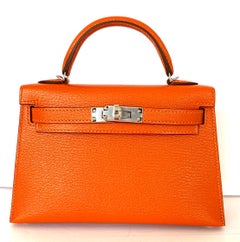 Hermes New Kelly Mini 20 Orange Feu Verso Pink Rose Inside