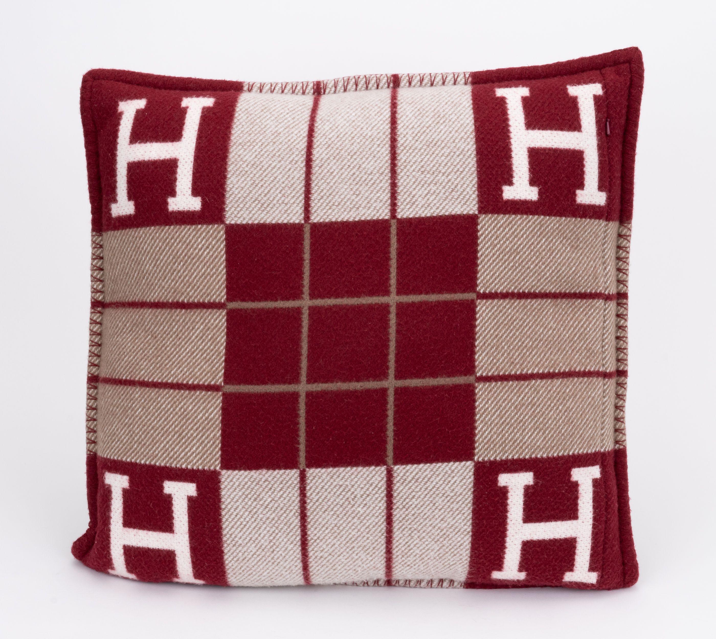 Up for sale brand new Hermès large Avalon pillow in discontinued burgundy color way. Taupe an cream decoration. 90% wool, 10% cashmere. Dry clean only.