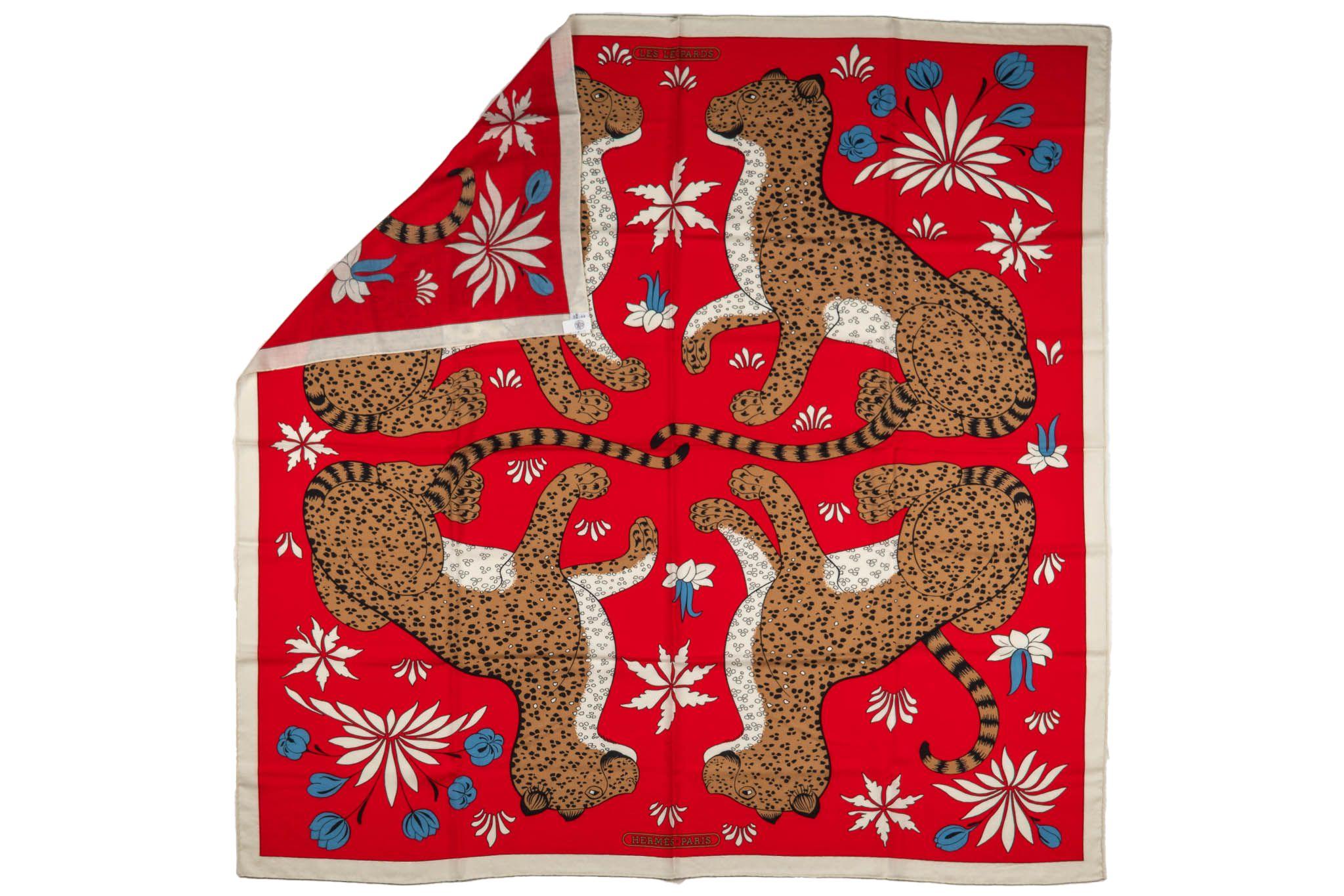 New with original box highly collectible cashmere and silk shawl. Les leopards design in red and brown color way.