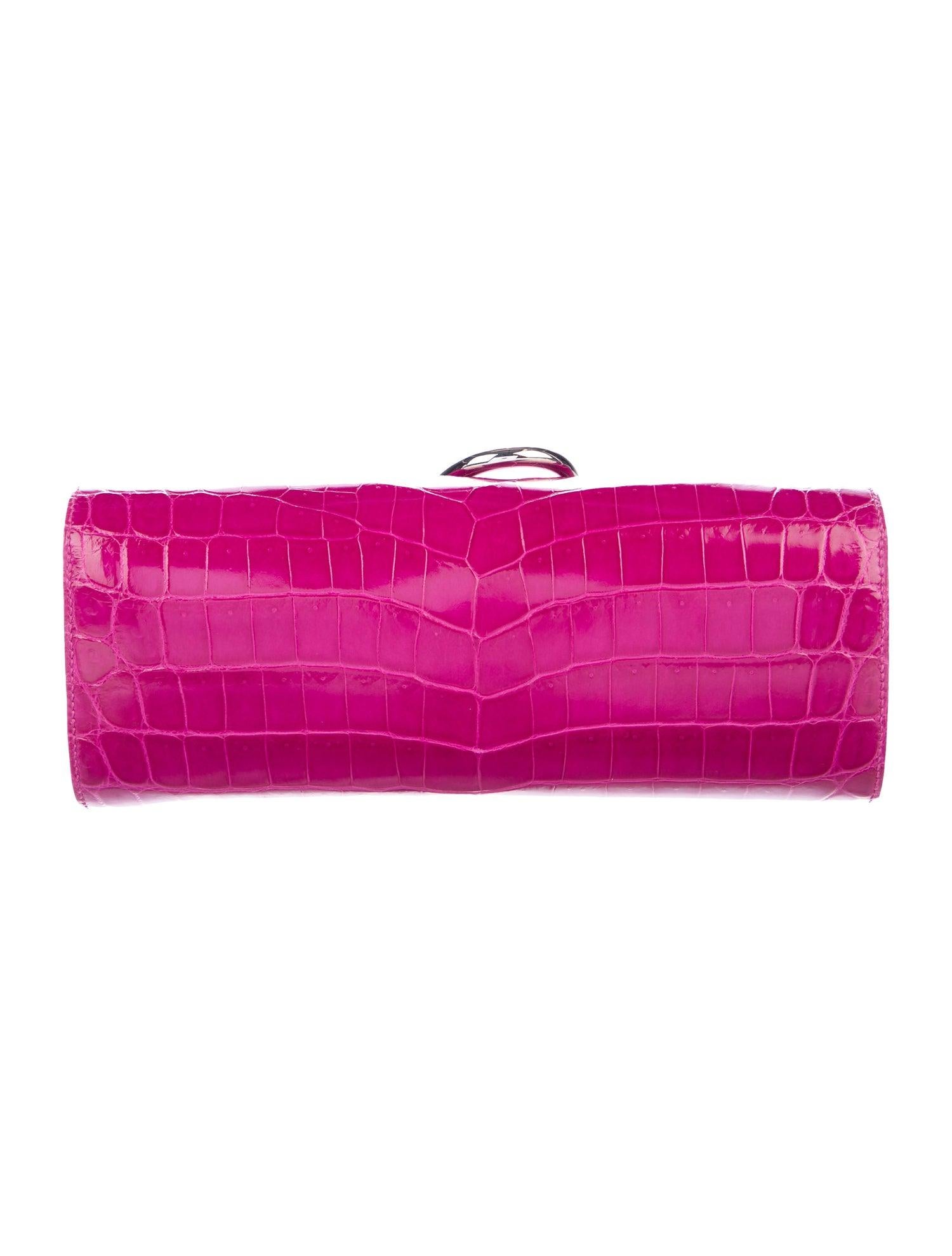 Hermes NEW Magenta Pink Crocodile Exotic Leather Palladium Egee Clutch Flap Bag in Box

Crocodile
Palladium-plated hardware
Leather lining
Magnetic closure
Measures 10