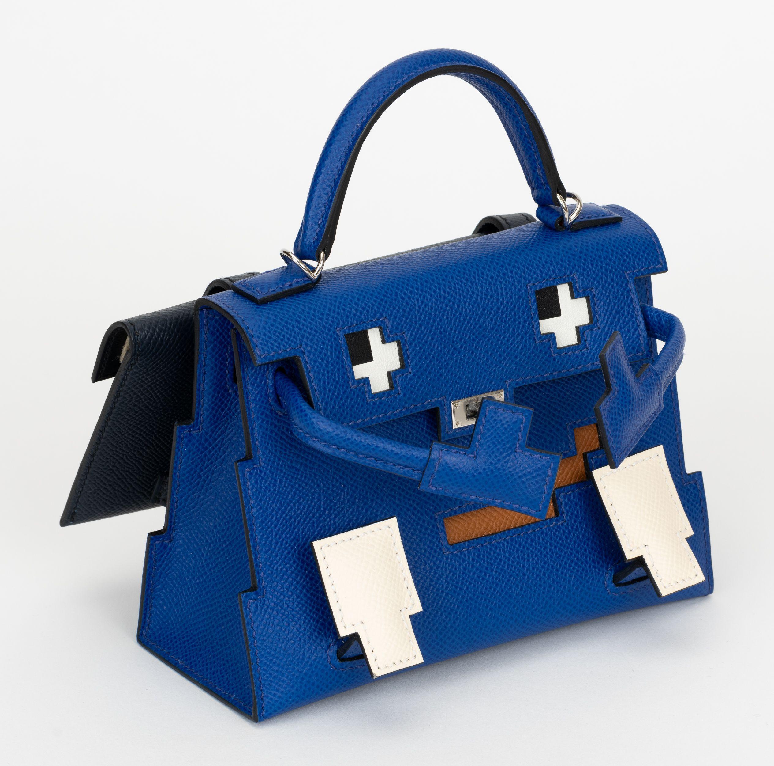 Hermès rare and collectible Kelly Idole Picto bag in blue royale, nata and gold epsom leather. Palladium hardware. Black leather for the funky detachable backpack that can fit a phone. Brand new with detachable shoulder strap, limited edition blue