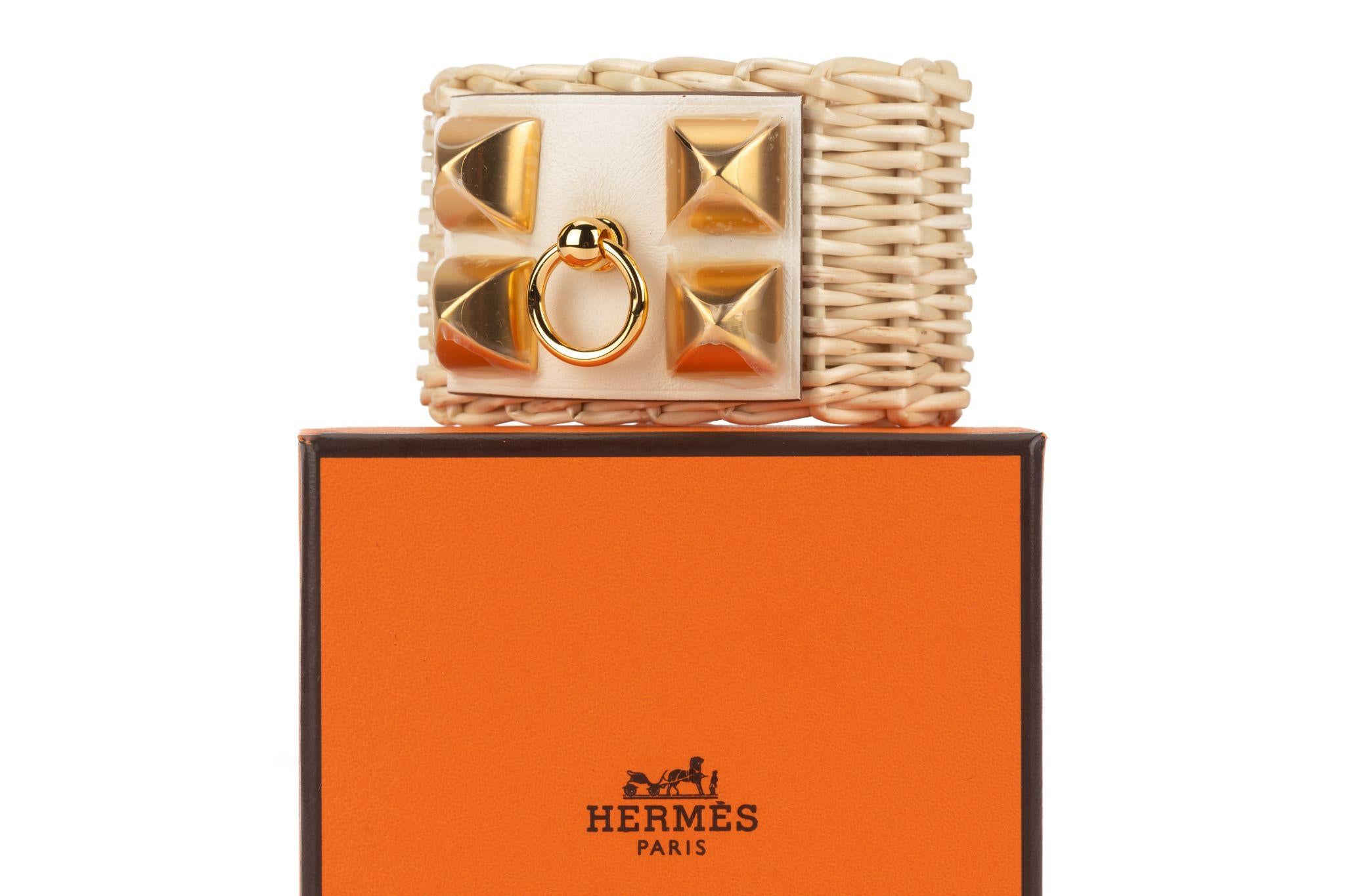 Hermès Natural Wicker cuff bracelet with nata leather feature and golden studs. Size t2. The piece is in new condition and comes with dust cover, booklet, box and ribbon. Plastic on hardware.