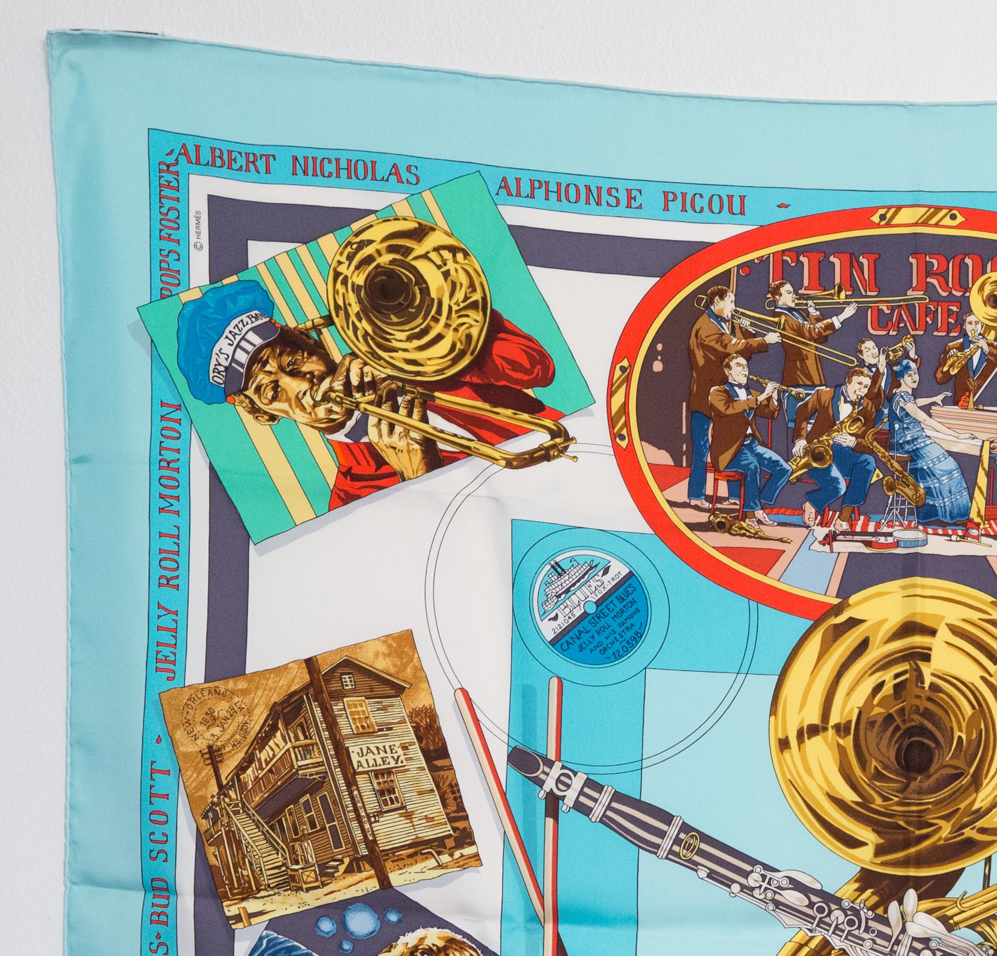 Hermes silk scarf New Orleans Creole Jazz 1923 by Loïc Dubigeon featuring a turquoise border. First edition 1996.
In excellent vintage condition. Made in France.
35,4in. (90cm)  X 35,4in. (90cm)
We guarantee you will receive this  iconic item as