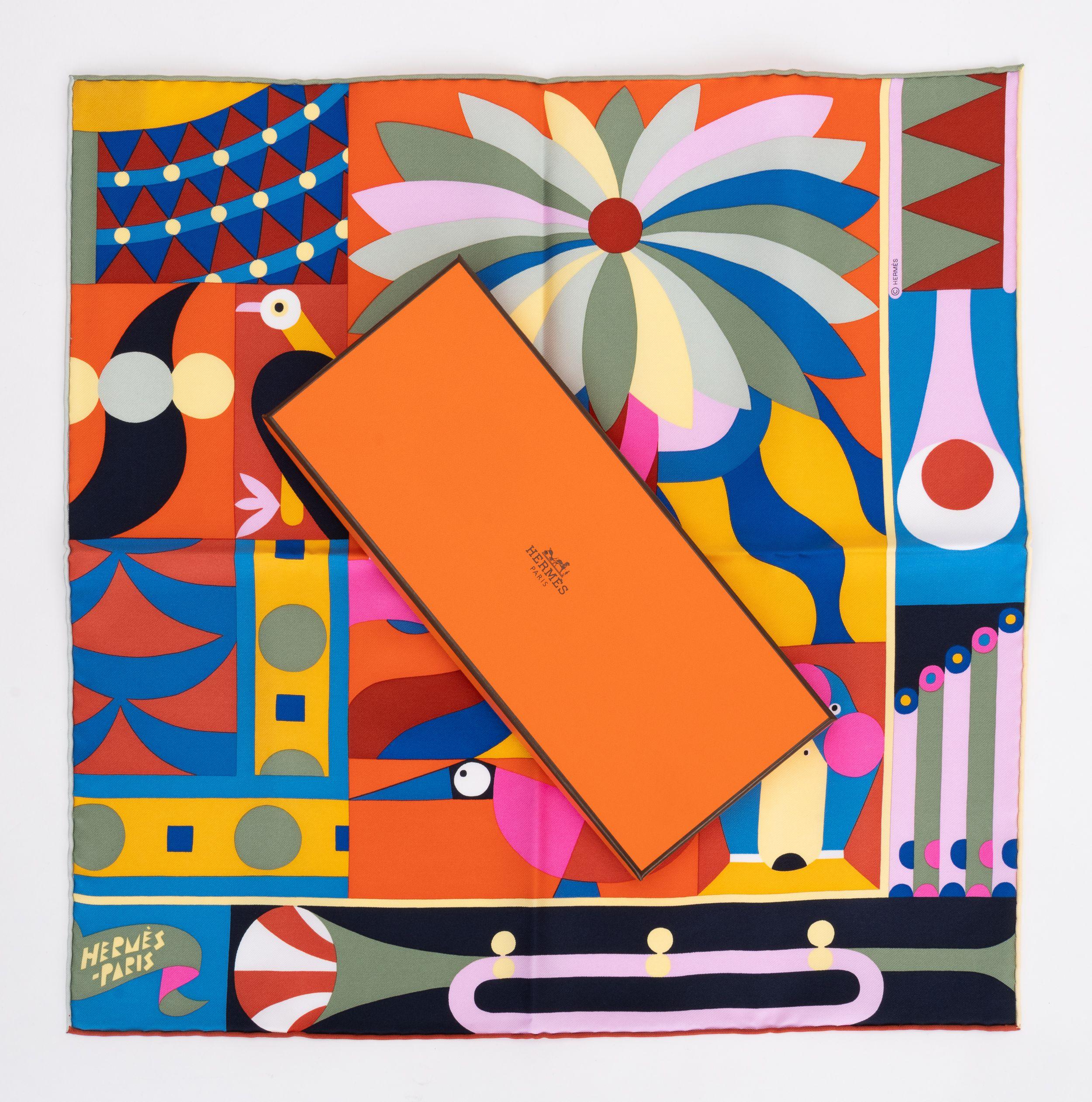Hermès New Parade En Fanfare Gavroche orange and multicolor combination. Hand rolled silk. Comes with original box.