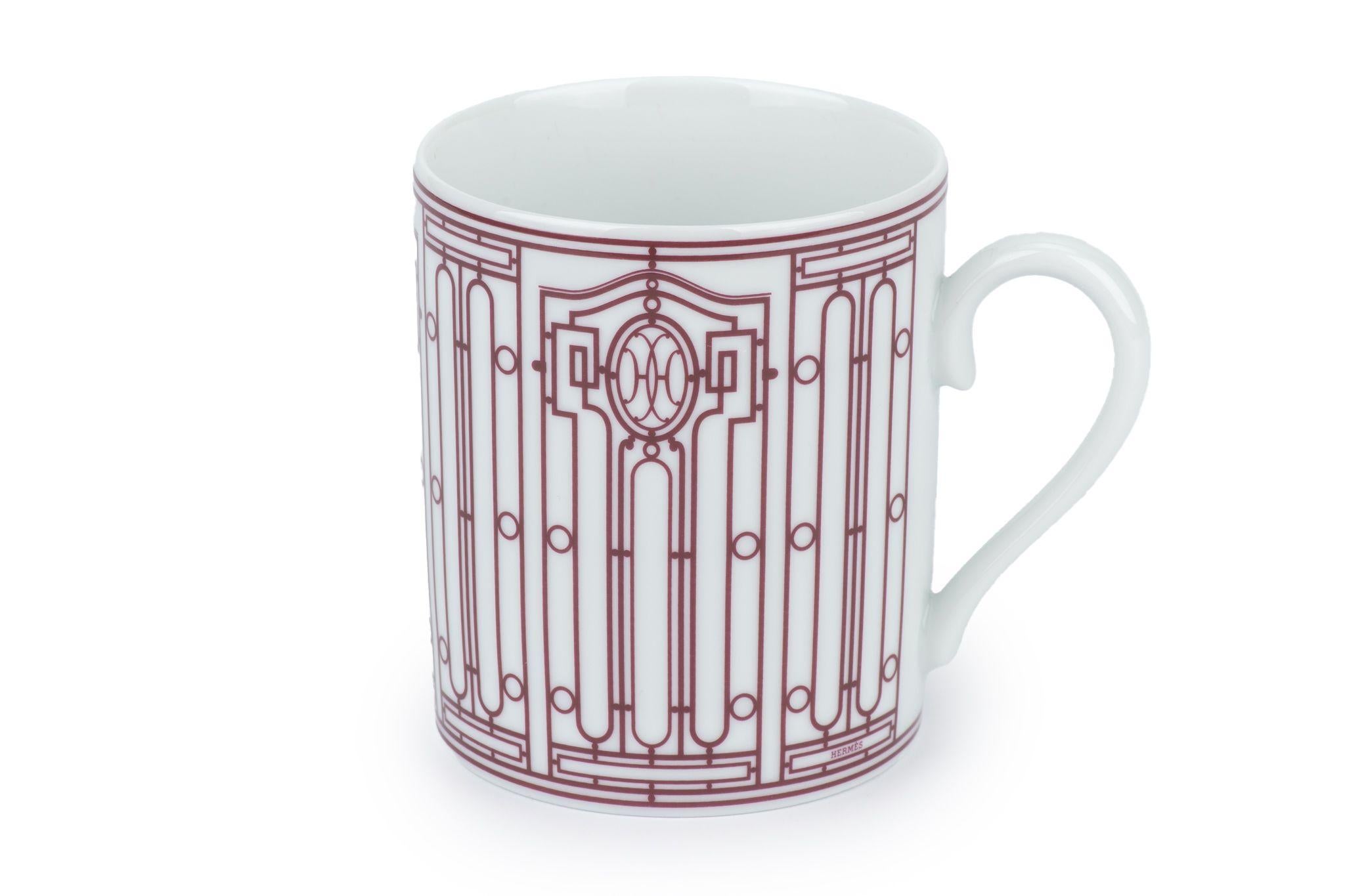The Hermès H Art Deco Mug, features the Hermès 24 Faubourg and rue de Sèvres stores, inspired H Déco collection including the mug. The service is stamped with the initials HH, around which an intricate black and white decoration spirals. 
New, comes