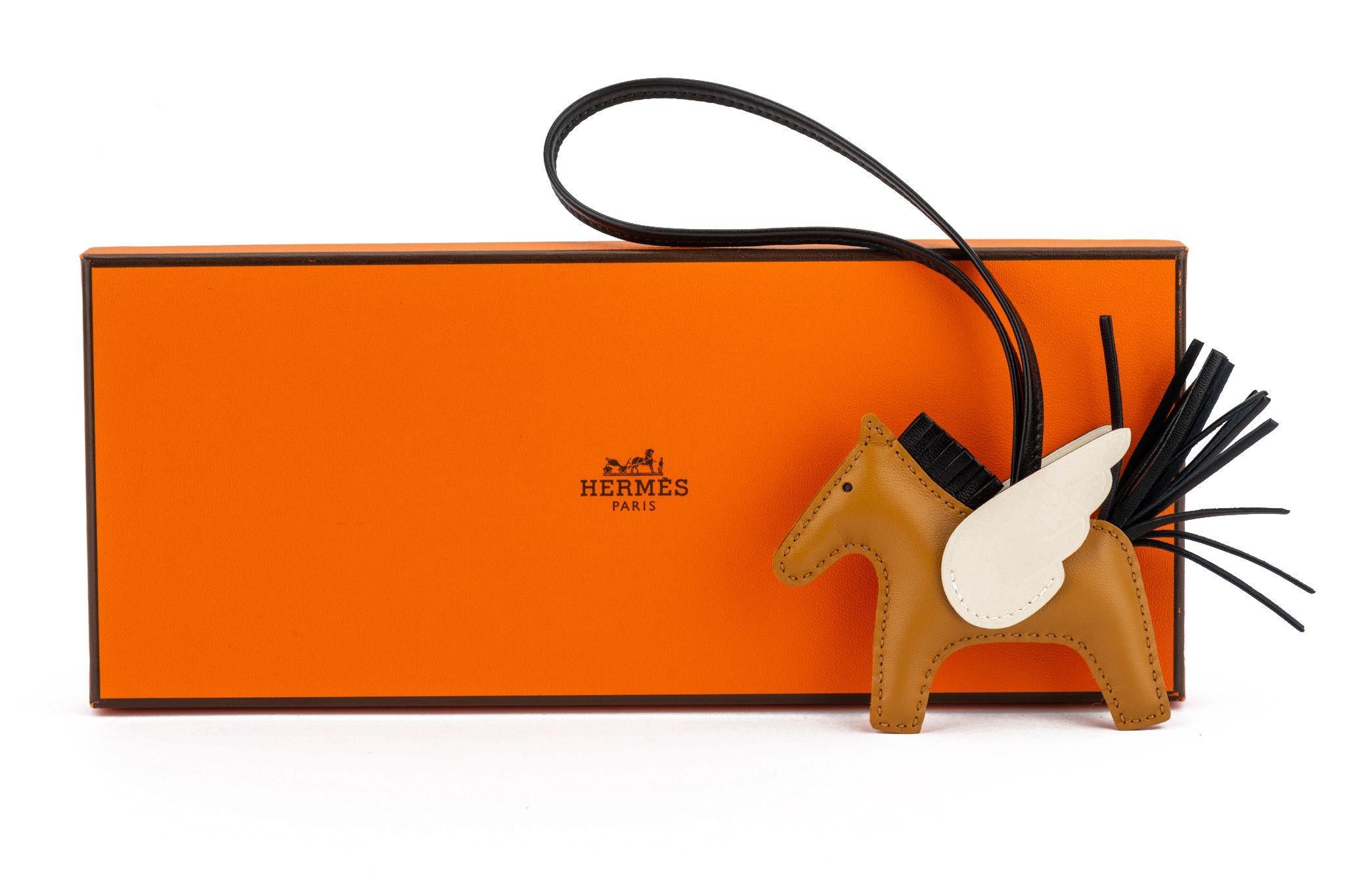 Hermès new in box limited edition rodeo Pegase small charm. Gold, black, nata. Comes with original box .