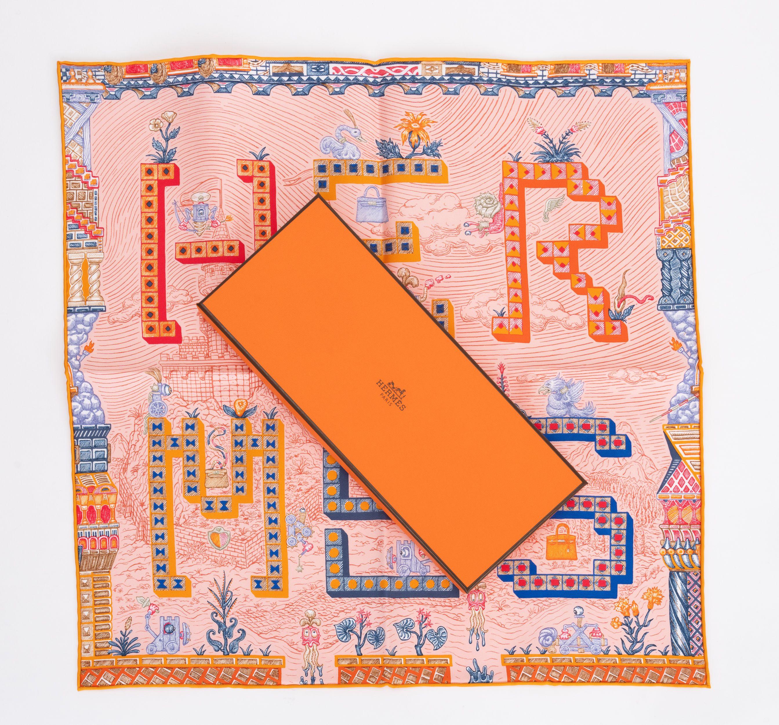 Hermès brand new in box quest pink and multicolor silk gavroche. Hand-rolled edges. Comes with original box.