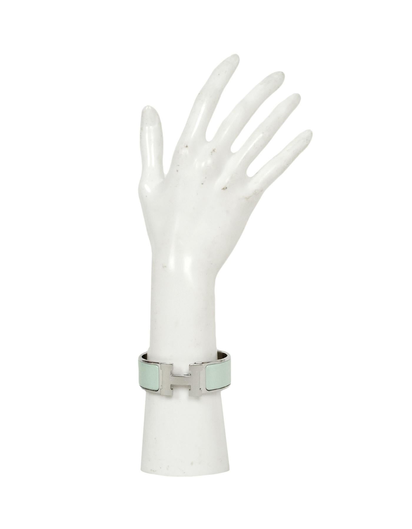 Hermes New Vert Argile/Palladium Wide Enamel H Clic Clac Bracelet
Color: Light blue and silvertone
Materials: Enamel, palladium plated metal
Closure/Opening: Swivel H
Overall Condition: Like new pre-owned condition.  Please note that this item has