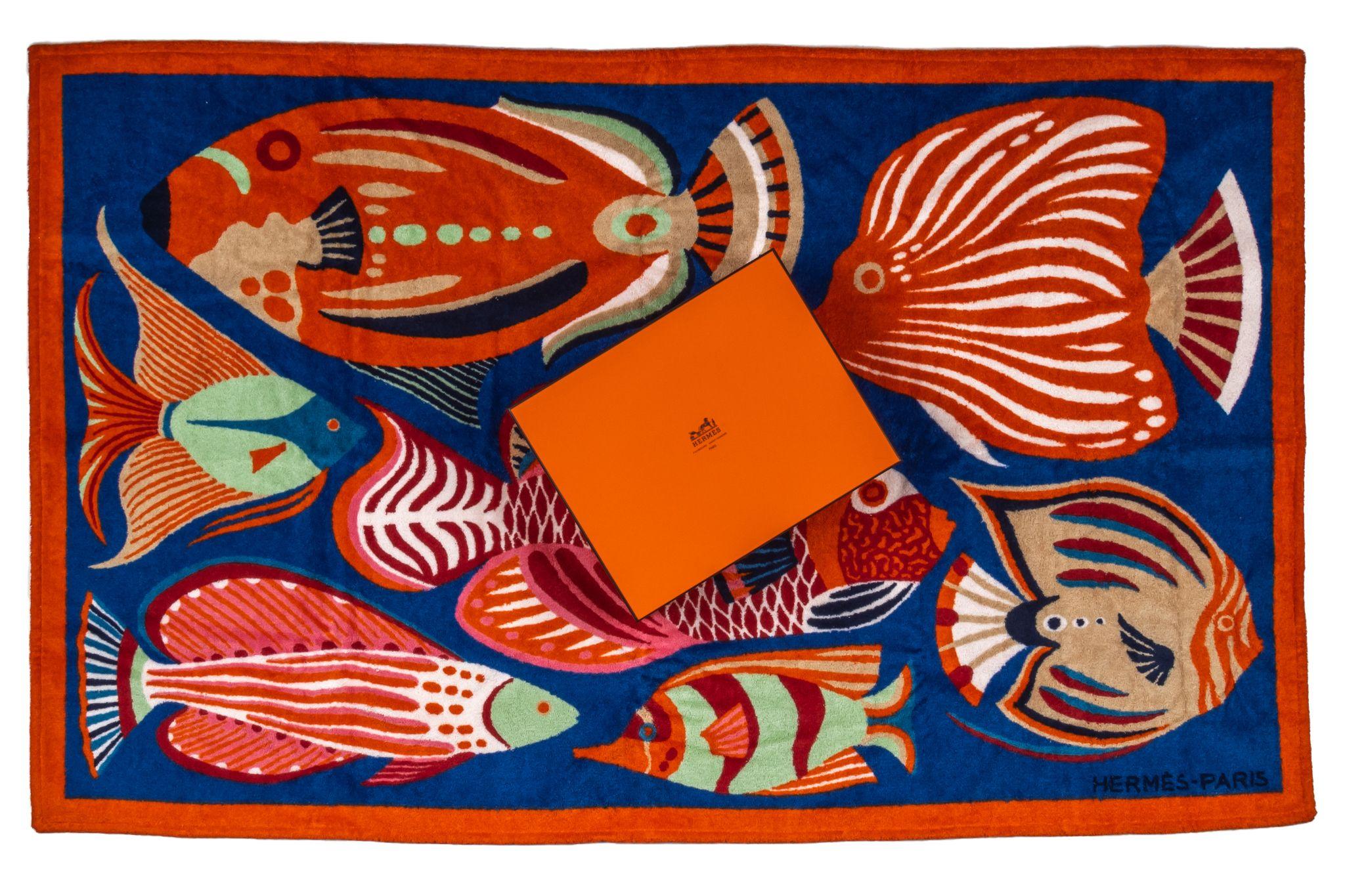 Hermès Fish Beach Towel. The pattern features several fishes in different colors. The piece is new and comes in the original box.