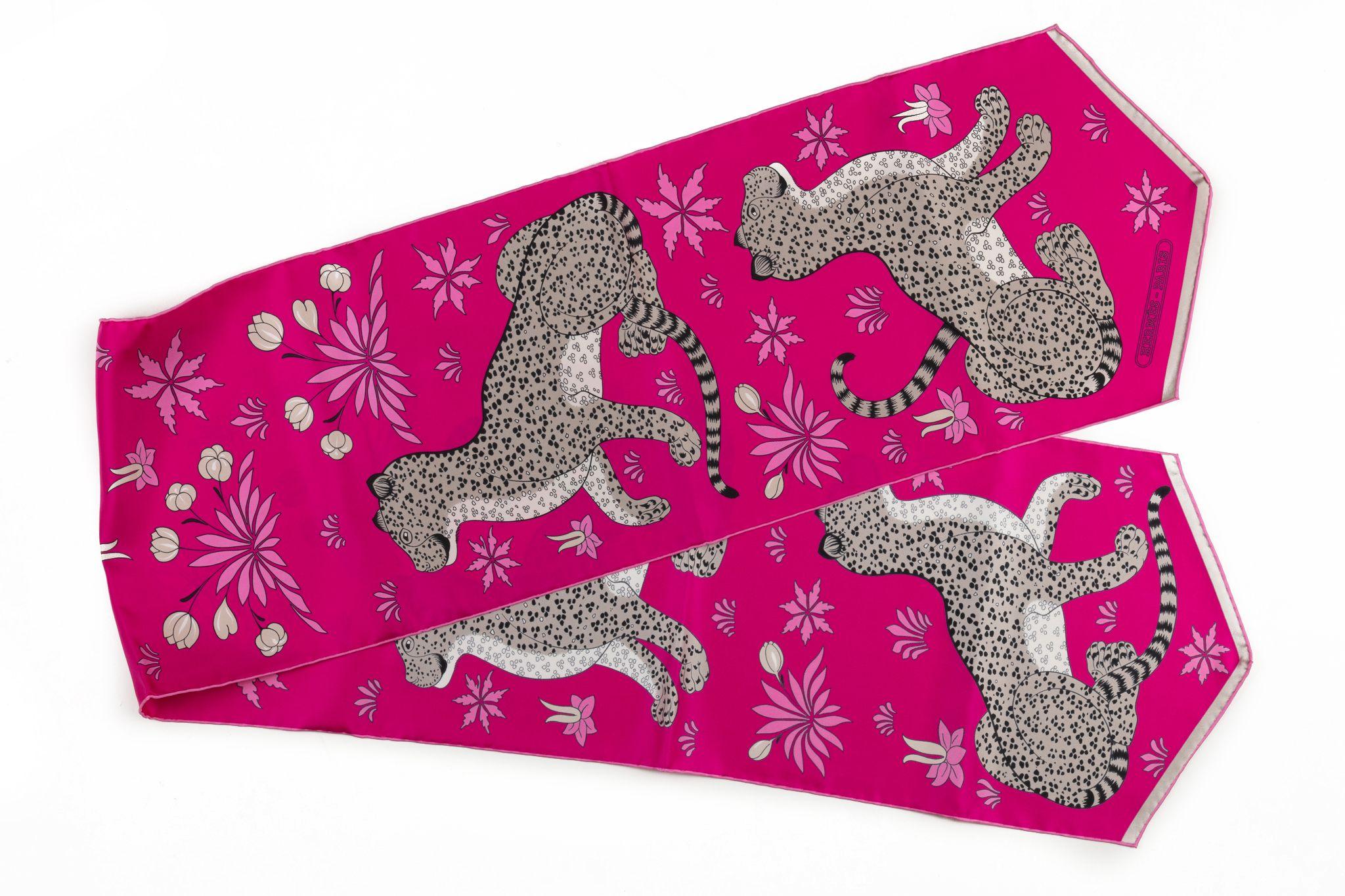 Hermès new fuchsia guepards silk stole. Comes with original box.