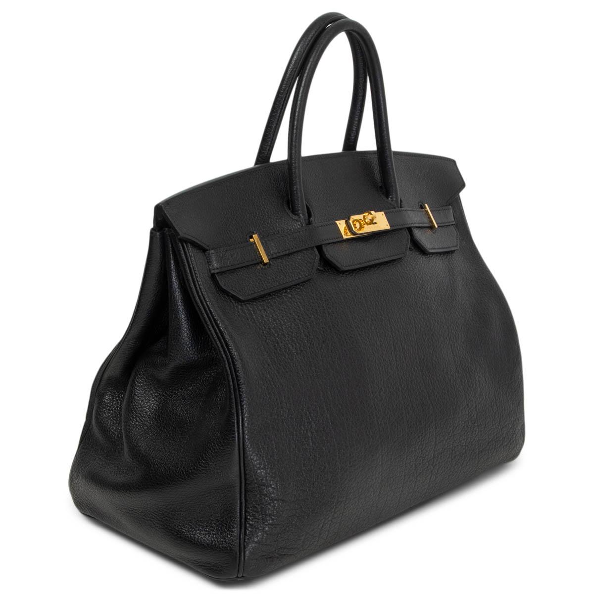 100% authentic Hermès Birkin 40 bag in black Buffalo Skipper leather with gold-tone hardware. Lined in black Chevre (goat skin) with an open pocket against the front and a zipper pocket against the back. Has been carried and is in excellent