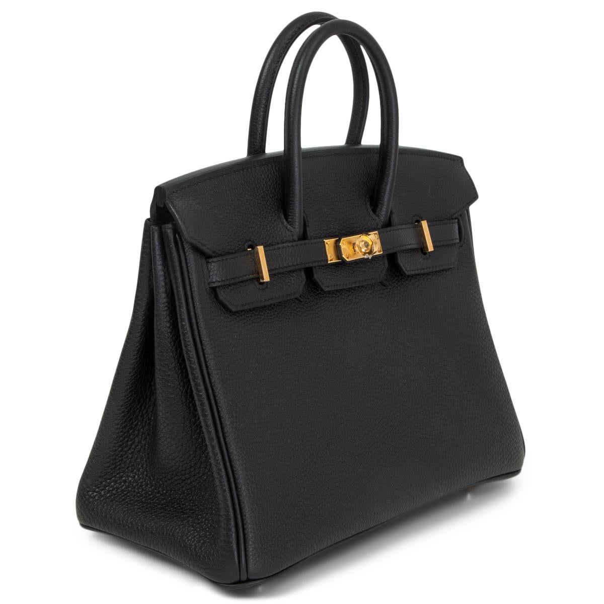 100% authentic Hermès Birkin 25 bag in Noir (black) Taurillon Clemence leather with gold-plated hardware. Lined in Chevre (goat skin) with an open pocket against the front and a zipper pocket against the back. Brand new. Comes with keys, lock,