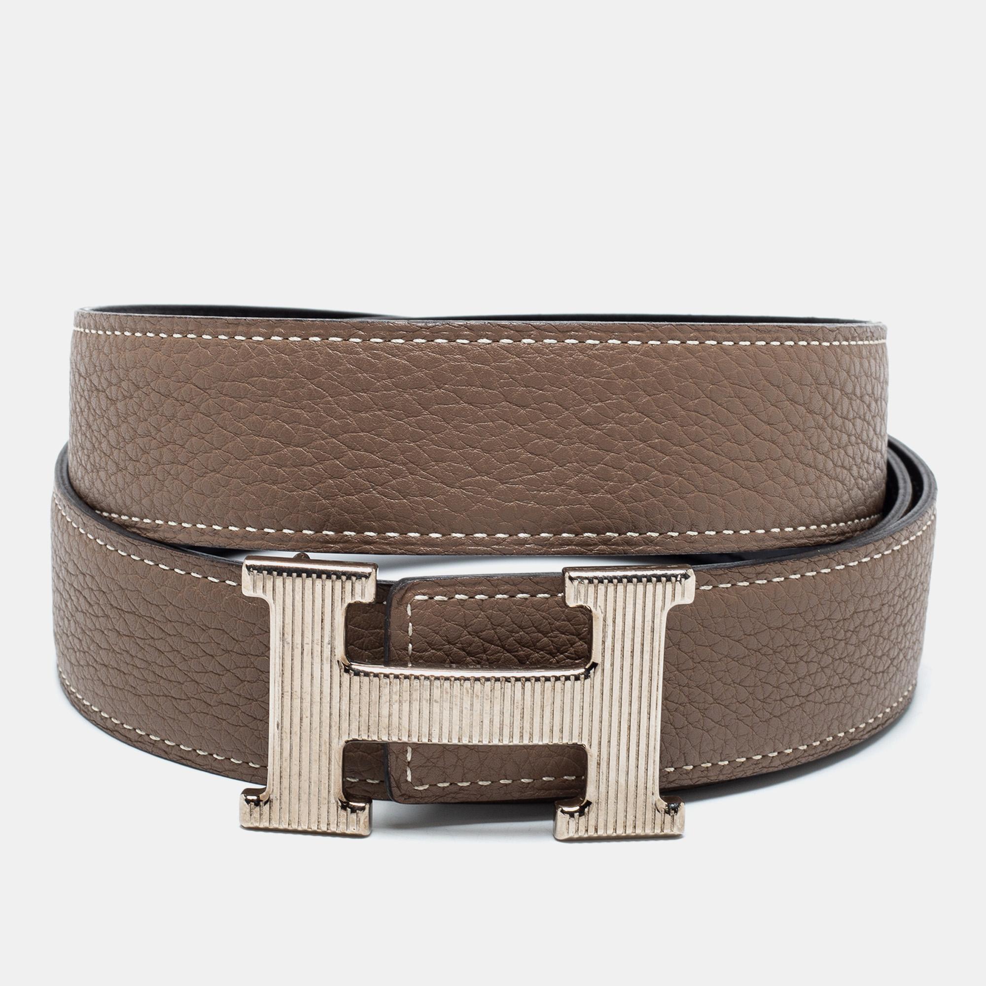 This Hermes reversible belt is crafted from Chamonix and Togo leather. The classic piece has dual shades to match a variety of outfits. It is completed with a silver-tone H buckle.

Includes: Original Box
