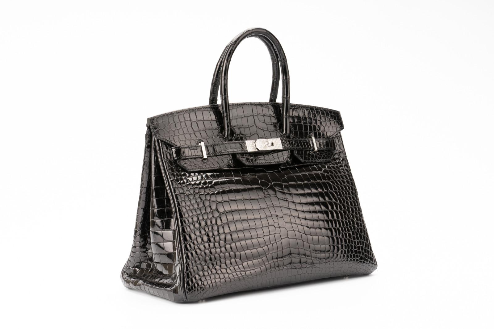 Exceptional Hermes bag, in black Porosus Crocodile with 18K white gold hardware and more than 200 diamonds totaling in approx. 10.70 carats. This iconic handbag is so rare to be found in such an

excellent condition and in the most precious shiny