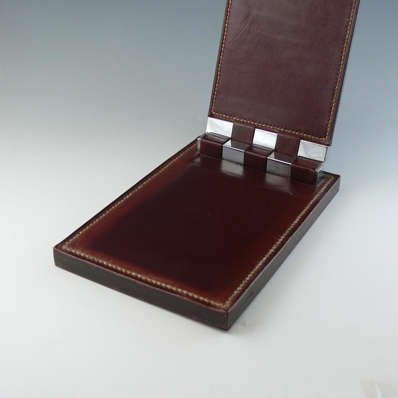 A stylish Hermès note pad in ox blood leather designed by famed French decorator Paul Dupré-Lafon, circa 1935.

Dimensions: 20 cm/8 inches x 13.5 cm/5¼ inches

Bentleys are Members of LAPADA, the London and Provincial Antique Dealers