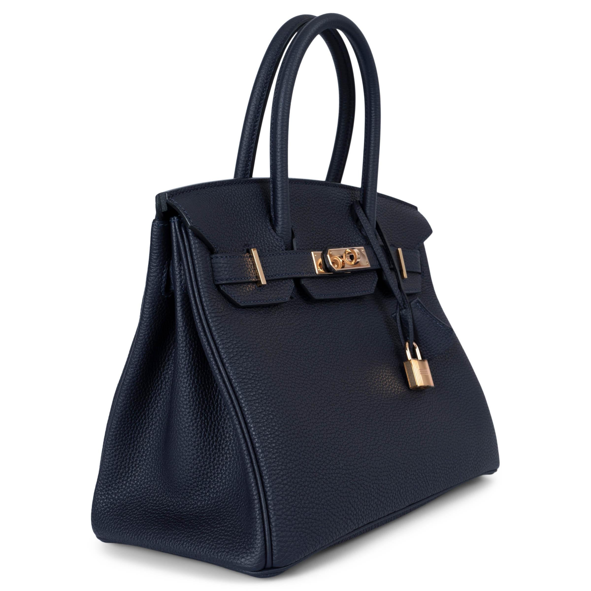 100% authentic Hermès Birkin 30 bag in Bleu Nuit (midnight blue) Veau Togo leather with rose-gold plated hardware. Lined in Chèvre (goat skin) with an open pocket against the front and a zipper pocket against the back. Has been carried once or twice