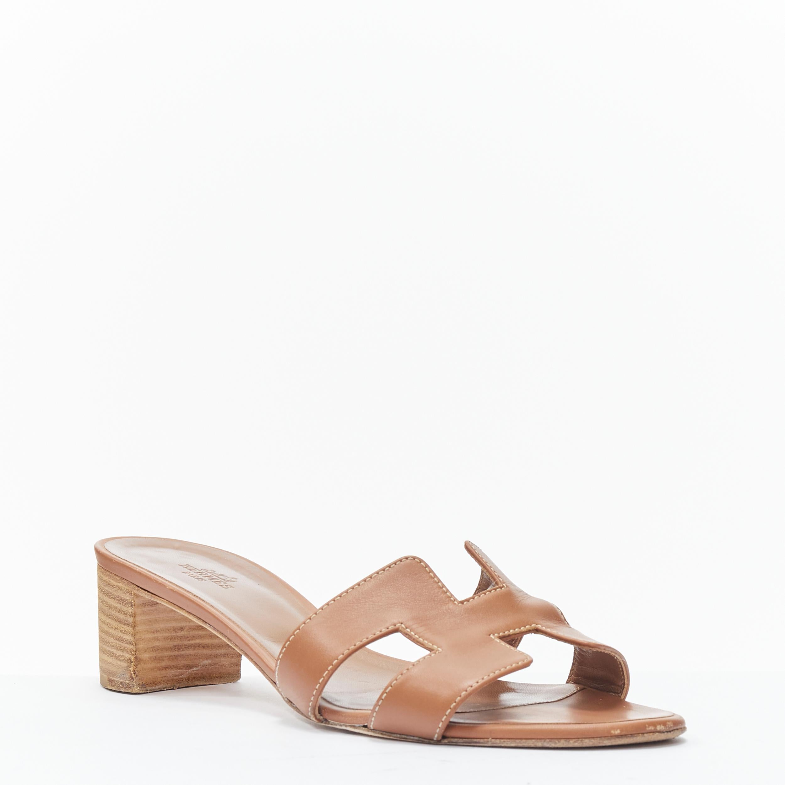 HERMES Oasis H logo tan brown leather wooden block heel slide sandals EU38.5 
Reference: TGAS/B01362 
Brand: Hermes 
Model: Oasis Tan sandals 
Material: Leather 
Color: Brown 
Pattern: Solid 
Extra Detail: Oasis H. Stacked wooden block heel. 
Made