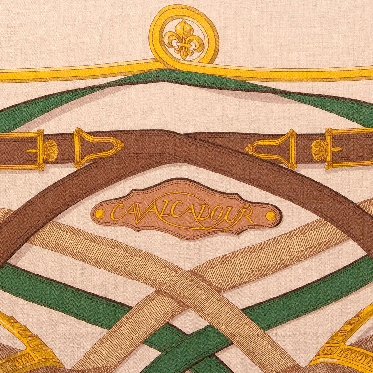 100% authentic Hermès 'Cavalcadour 140' shawl by Henri d'Origny in ivory cashmere (65%) and silk (35%) with details in yellow, brown, dark green and olive. Has been worn and is in excellent condition.

Story Behind:

Cavalcadour is a joyous