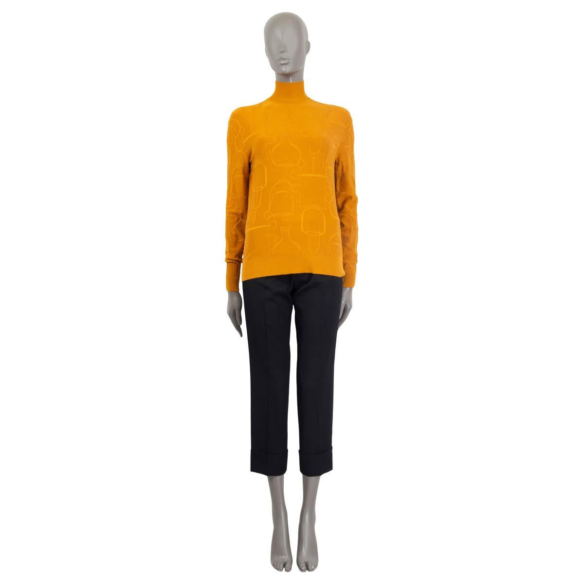 100% authentic Hermès oversized knit sweater in ochre cashmere (44%), silk (43%), polyamide (10%) and polyurethane (3%). Features a stirrup pattern, long sleeves and a high neck. Unlined. Has been worn and is in excellent