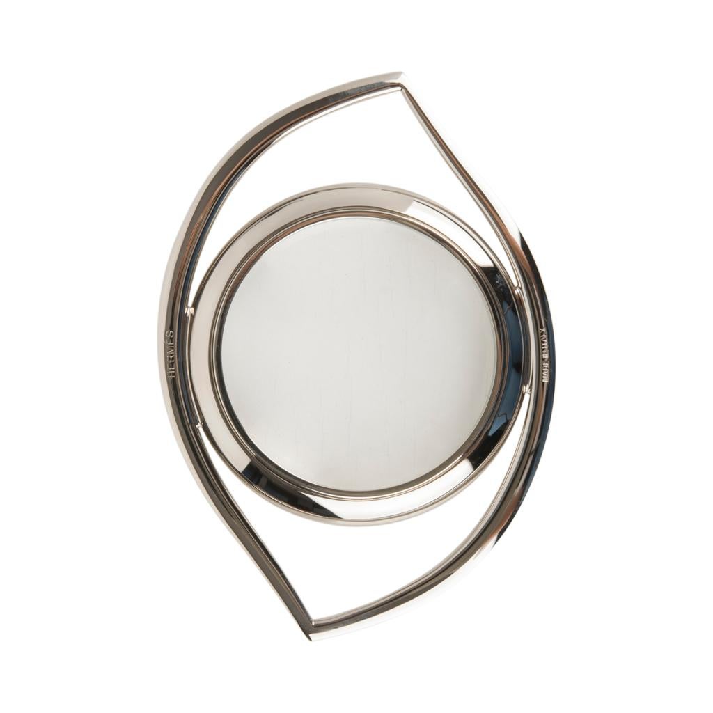 Guaranteed authentic Hermes Eye of Cleopatra magnifying glass / paperweight in palladium plated metal.
2.5X magnification
Beautiful blend of form and function, originally designed in the 60's by renowned 
French writer and film maker Jean Cocteau.
A