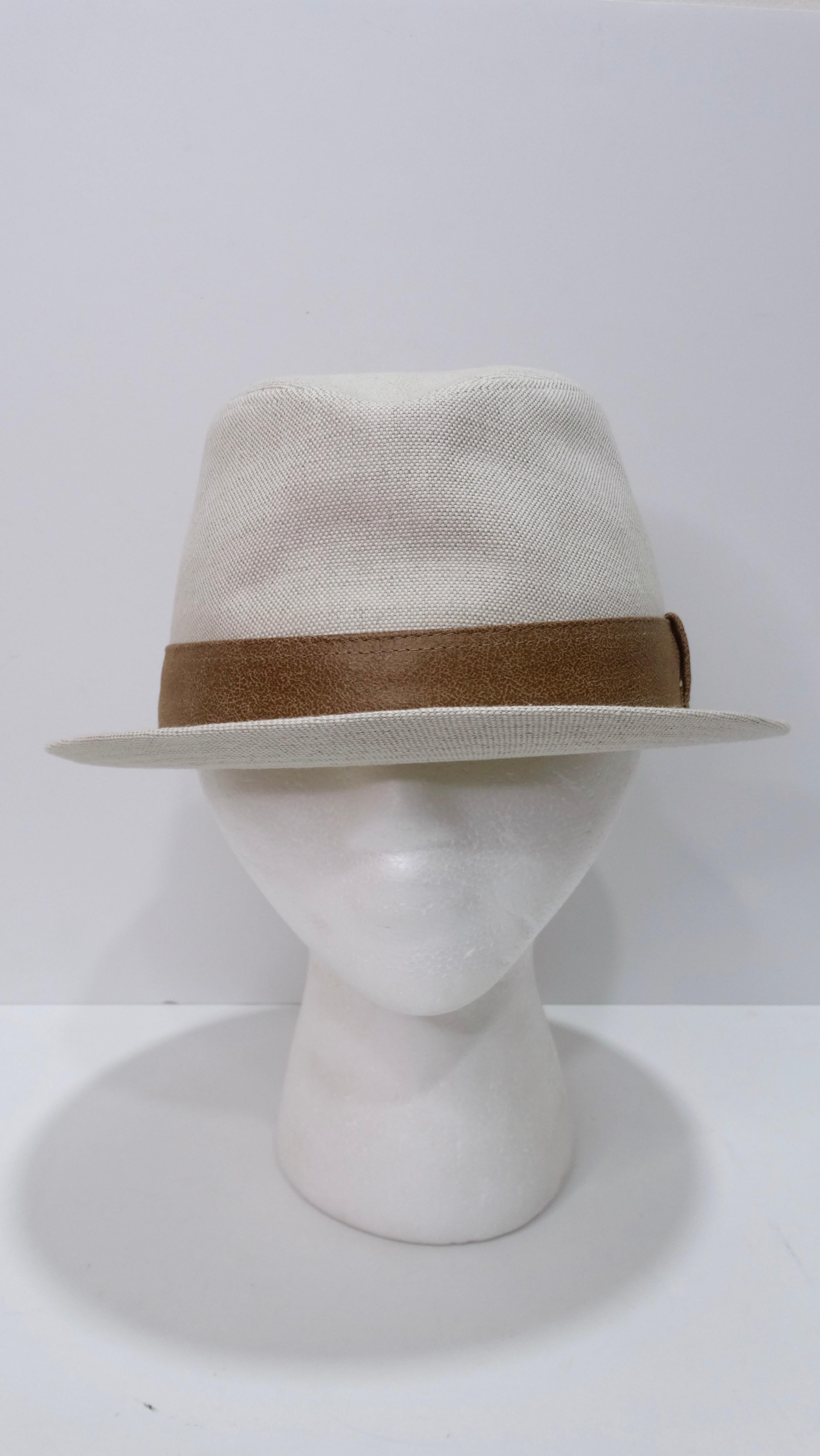 This off-white Hermes hat with a classic brown strap is a simplistic and stylish look that shows elegance and class. Bringing out both feminine and masculine undertones this hat can be worn by any gender. The hat is creased down the center toward