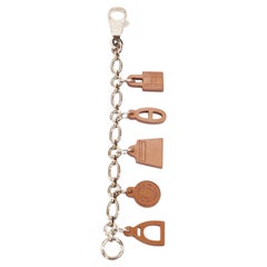 HERMES Olga Amulette Breloque fauve brown barenia chain kelly lock bag charm