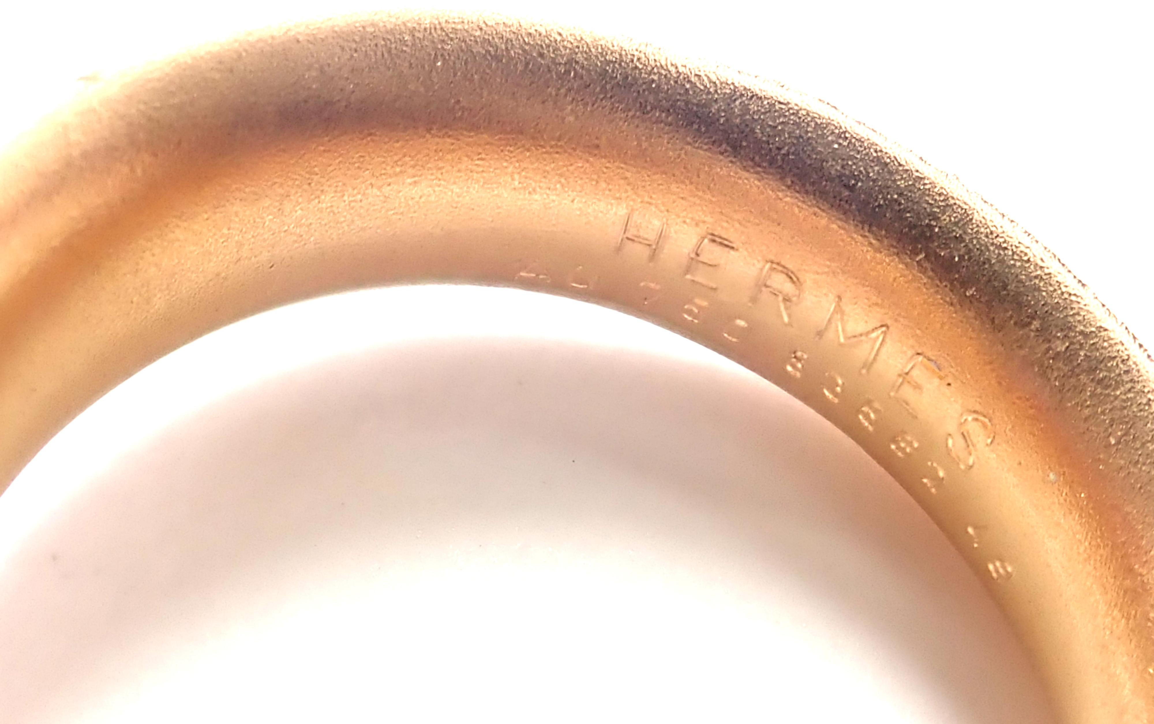 18k Rose Gold Olive Wood Band Ring by Hermes. 
Details: 
Size: European 49 US 4.75 
Weight: 7.7 grams
Width: 9mm
Stamped Hallmarks: Hermes 750 49 83562
*Free Shipping within the United States*
YOUR PRICE: $2,000
T2421ahe