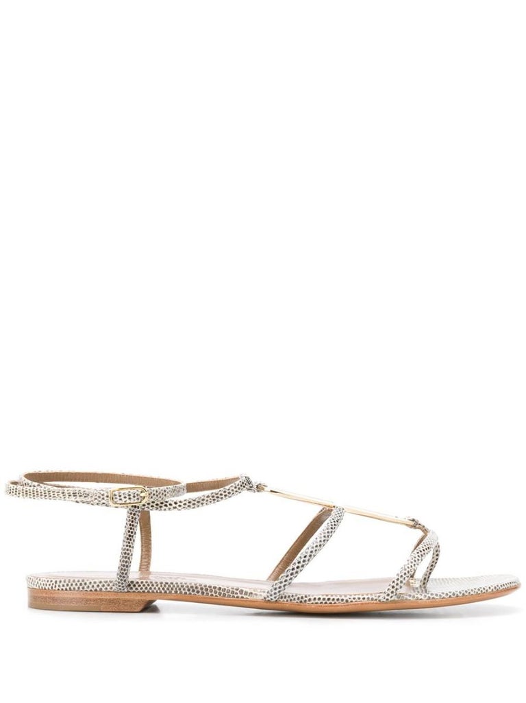 Crafted in Italy against an ombre backdrop of grey and beige-coloured  skin, these highly sought after sandals by Hermès features an elegant open-toe design, a central gold-tone metal bar accenting the central T-strap and double strapped, ankle