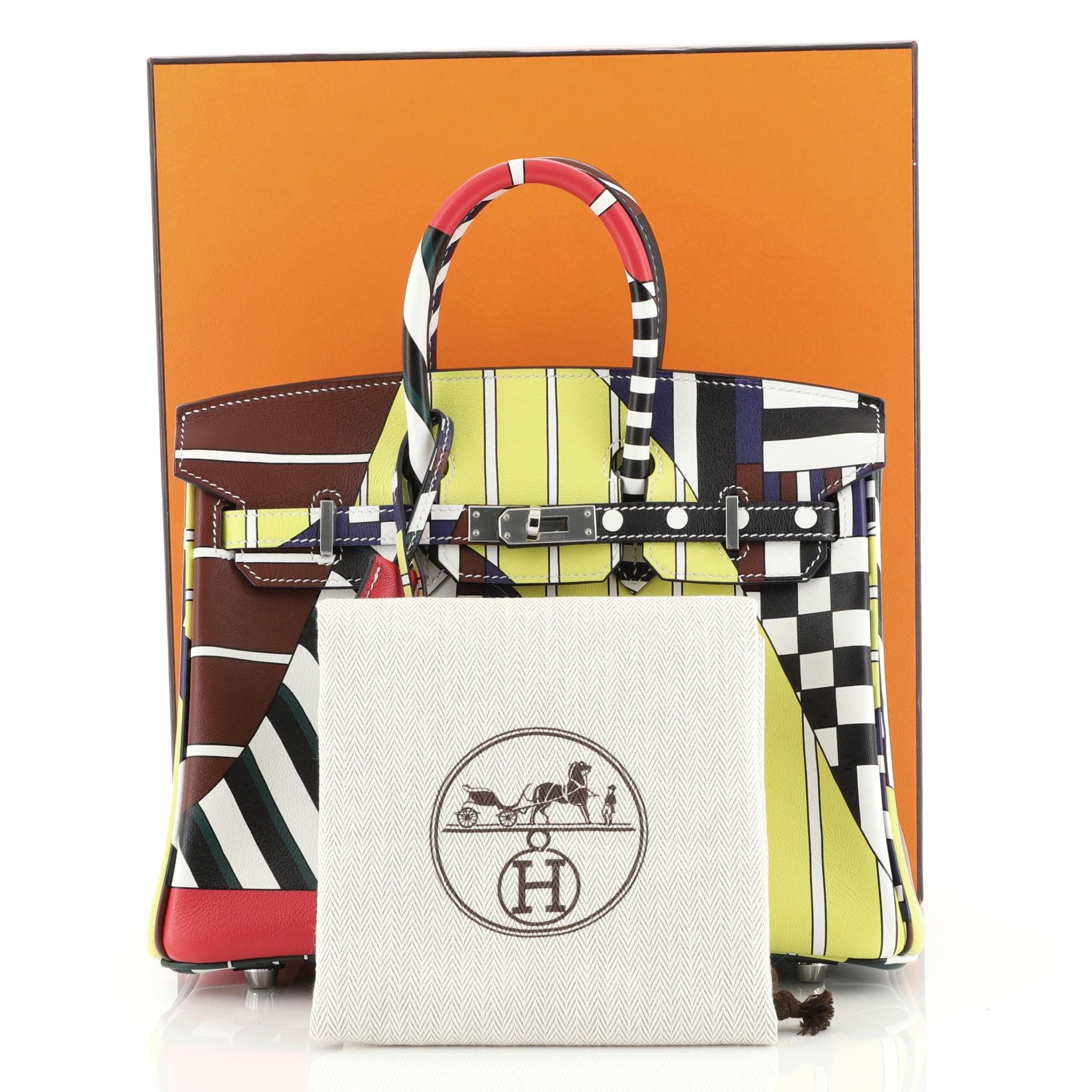 This Hermes One Two Three and Away We Go Birkin Bag Limited Edition Printed Swift 25, crafted in Multicolor printed Swift leather, features dual rolled handles, printed abstract sailboat and palladium hardware. Its turn-lock closure opens to a Bleu