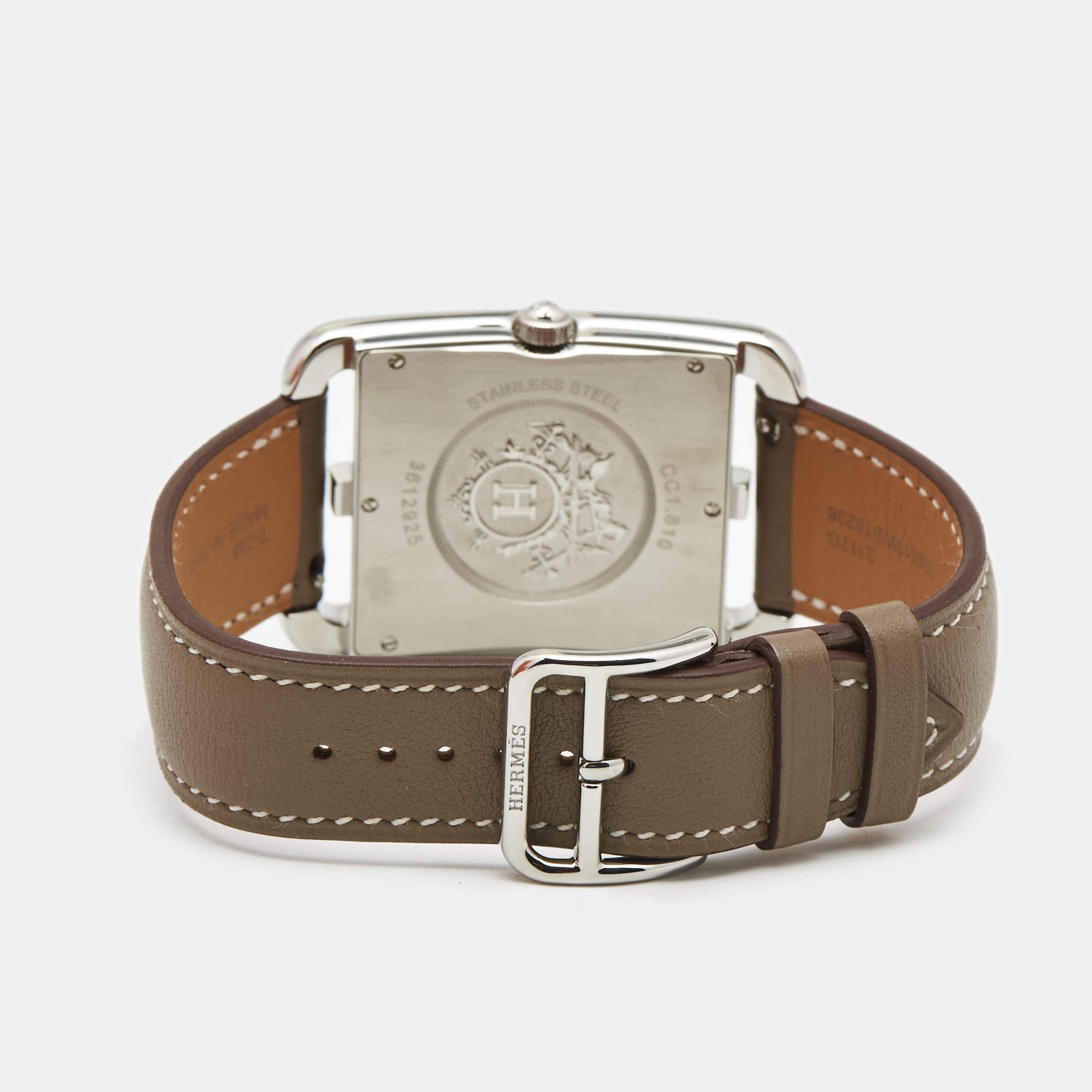 This Cape Cod watch from Hermes stands for quality and sophistication. The watch features a stainless steel case held by a leather strap that can be around your wrist and secured with a buckle. Powered by a quartz movement, this elegant timepiece