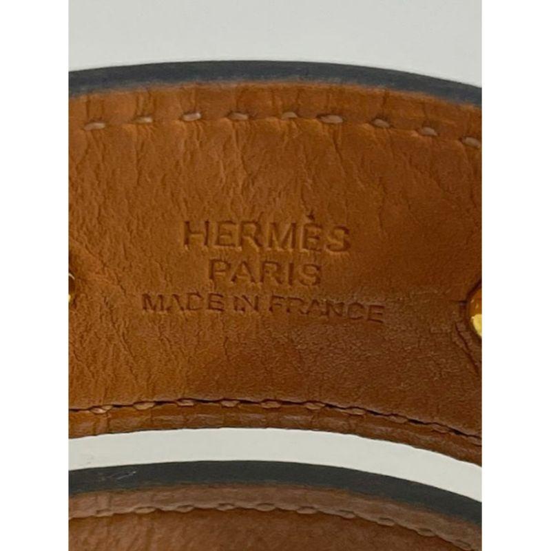 Manchette ouverte Hermes en cuir et plaqué or en vente 3