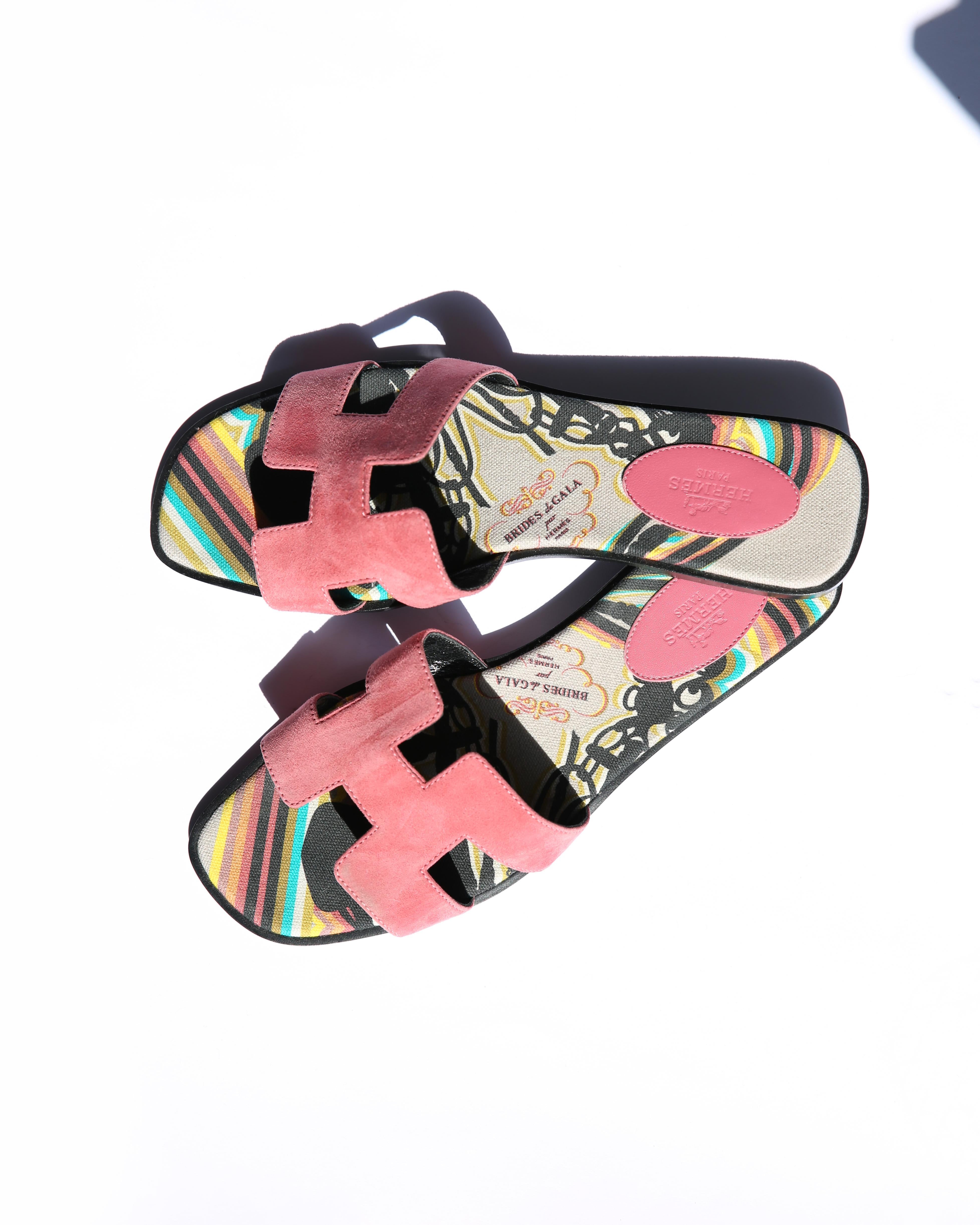 Hermes limited edition Oran sandals in 'Rose de Venise' pink suede
Fabric lined sole in brightly coloured Brides de Gala print 
Black wood heel with leather sole 

Size:
EU 39
US 9
UK 6

Condition: 
In excellent condition. Minor wear to the soles,