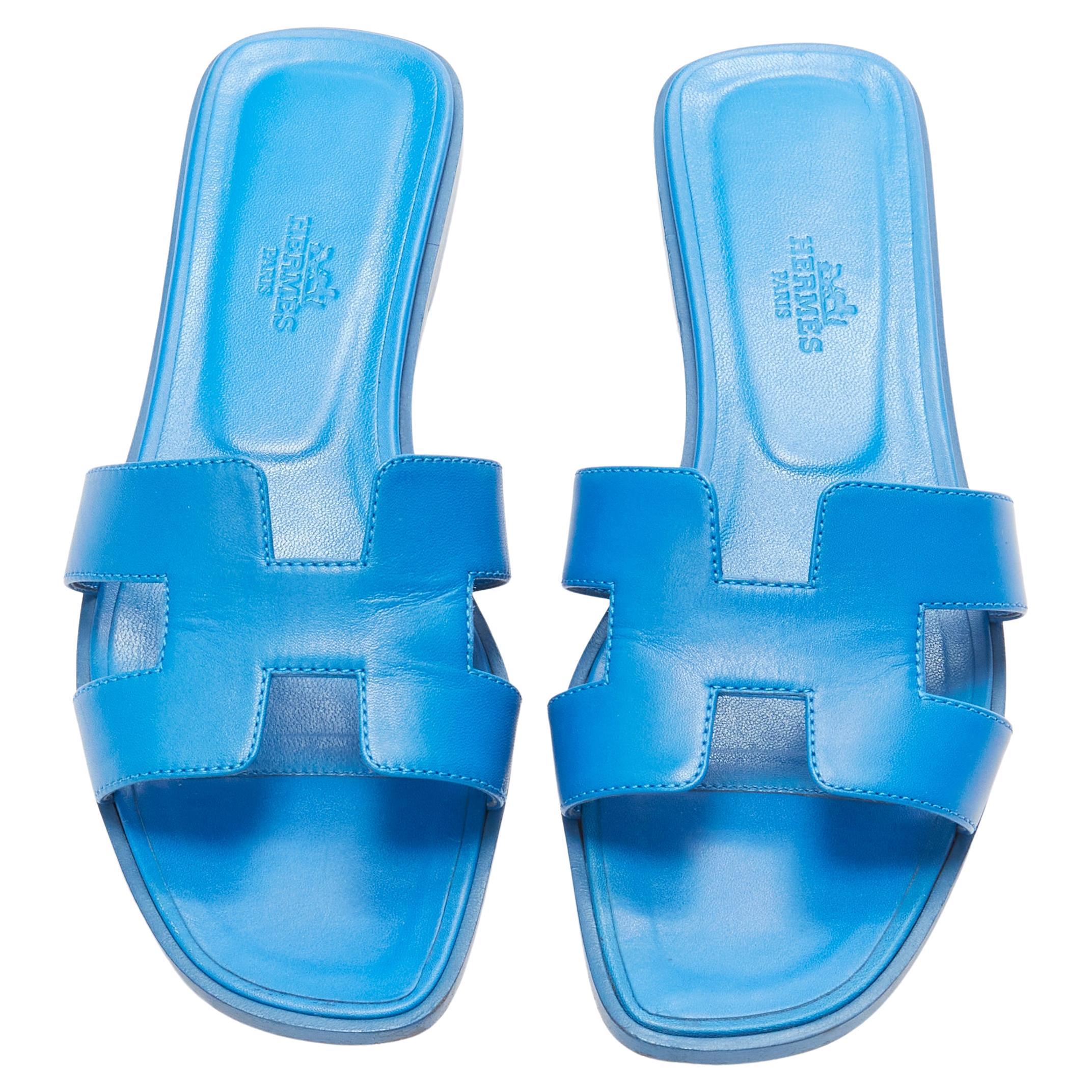 HERMES Oran cobalt blue smooth leather H flat sandals EU37.5 For Sale
