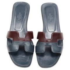 HERMES Oran dual tone burgundy navy leather H flat sandals EU37.5