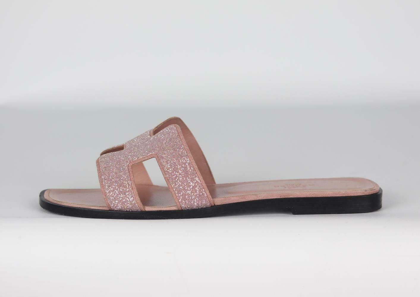 Hermès may specialize in luxury handbags, but the brand also designs great pieces that are suitable for everyday wear, these 'Oran' sandals are made from soft dusty-pink suede and leather and embellished with matching crystal on the top and has a