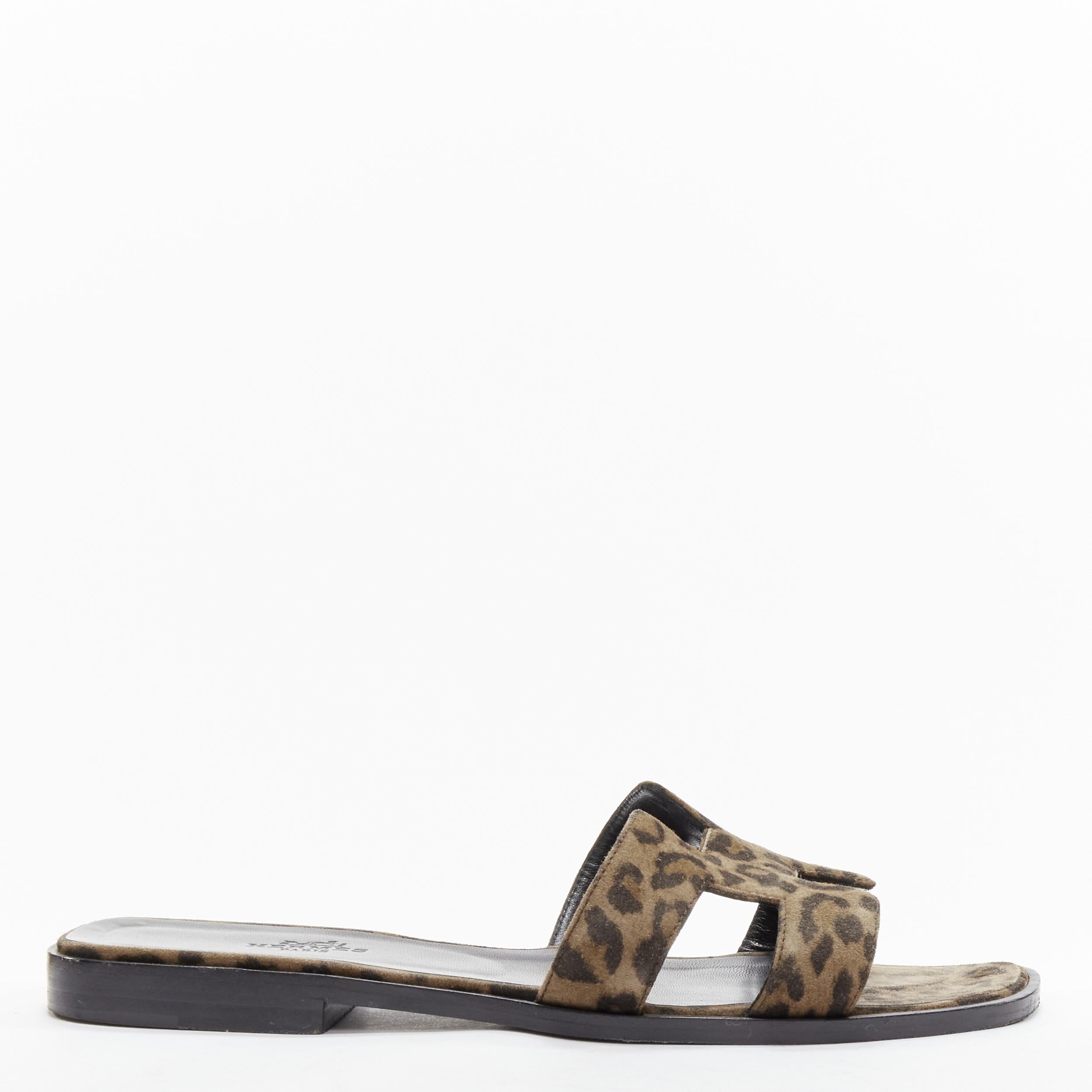 HERMES Oran H logo signature brown leopard print leather sandals EU37
Reference: LNKO/A02092
Brand: Hermes
Model: Oran
Material: Leather
Color: Brown
Pattern: Animal Print
Closure: Slip On
Lining: Leather
Made in: Italy

CONDITION:
Condition: Good,